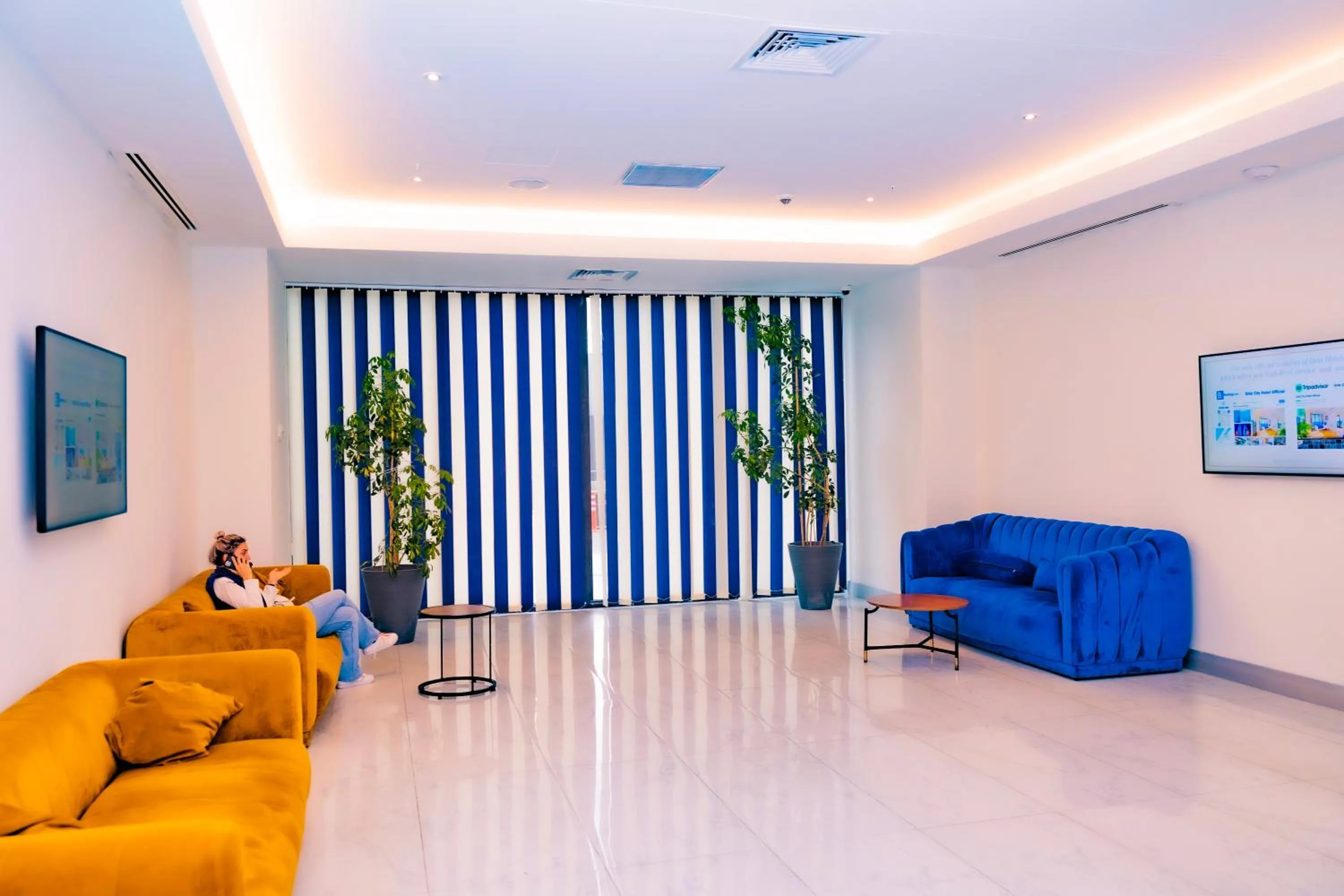 TV and multimedia, Seating Area in Orbi City Inn