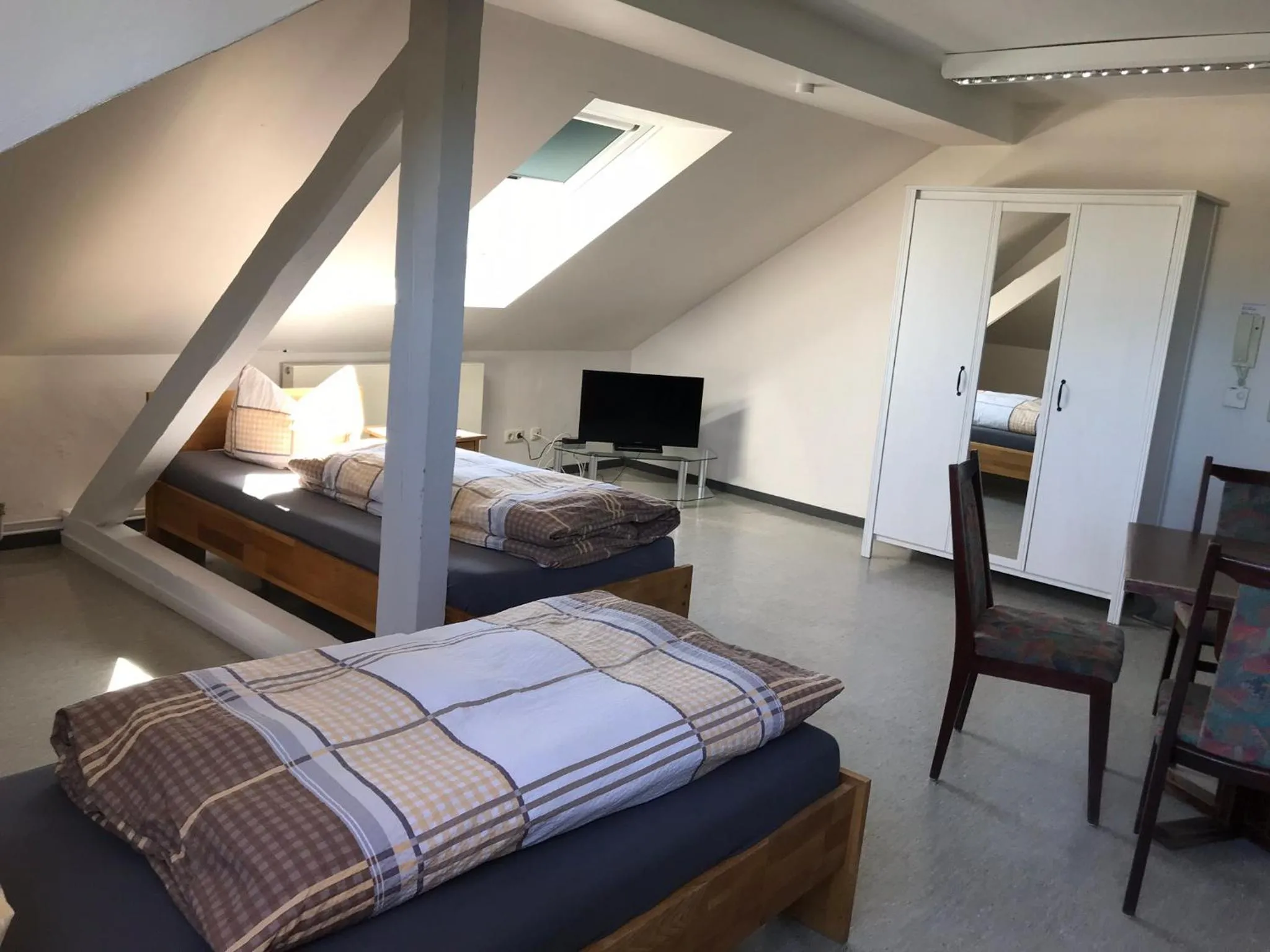 Communal lounge/ TV room, Bed in Gästehaus Sandra