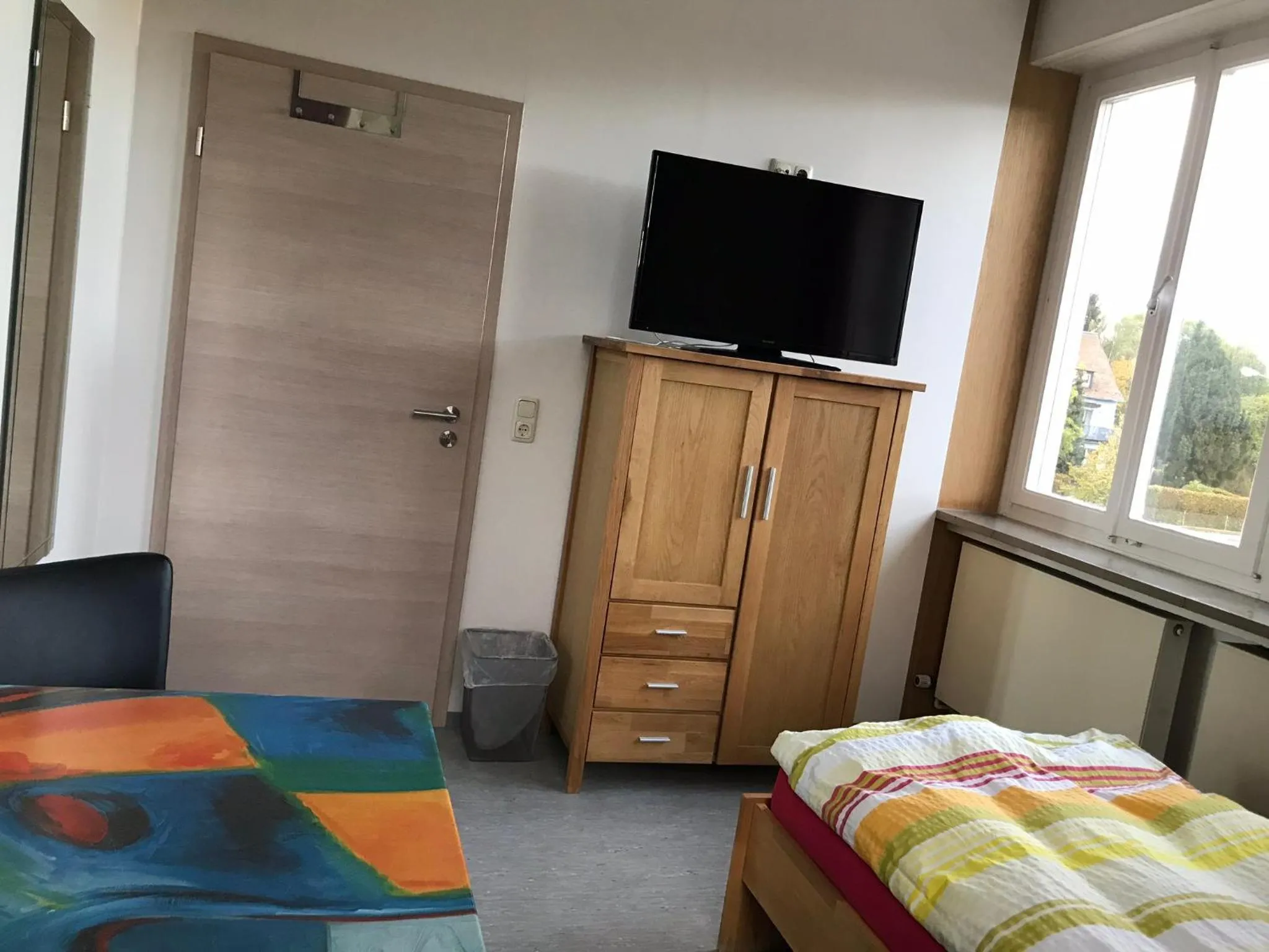 Communal lounge/ TV room, Bed in Gästehaus Sandra
