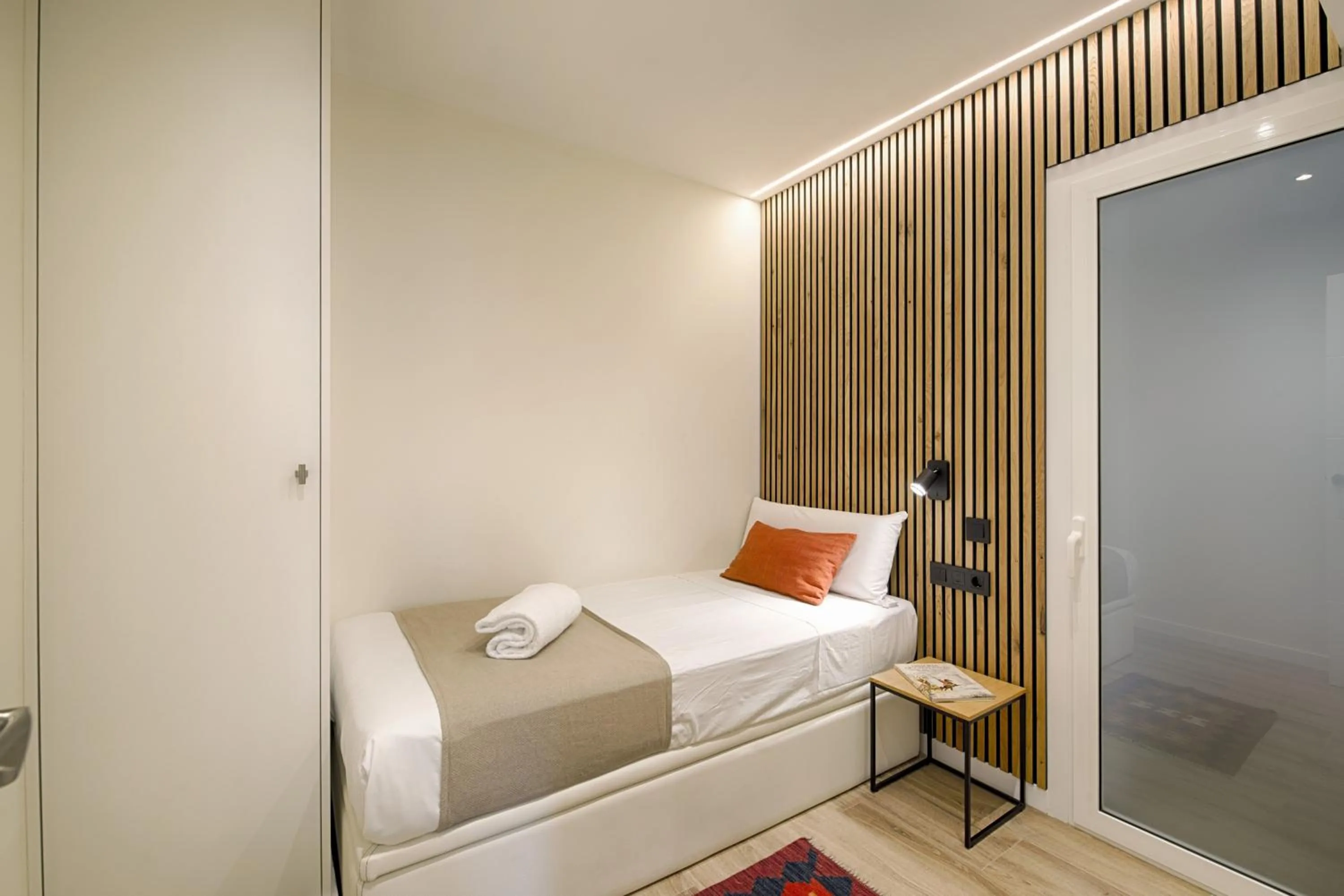 Bed in Eixample Building Apartments by Mercedes Heritage