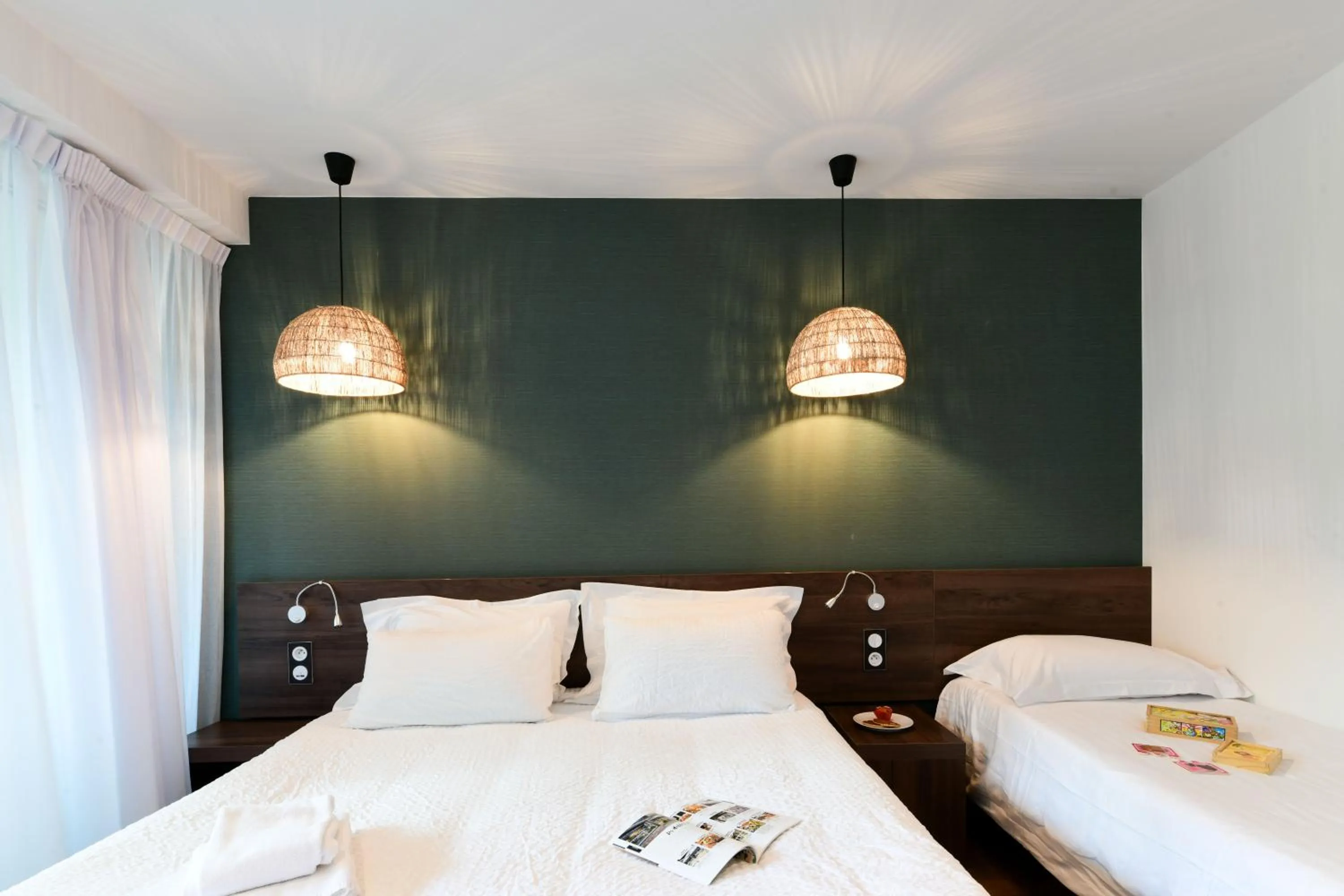 Bed in Hotel Logis Lacotel