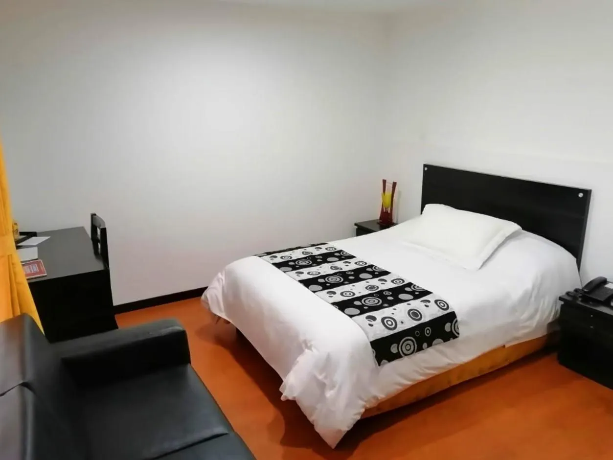 Bed in Hotel Palermo Suite