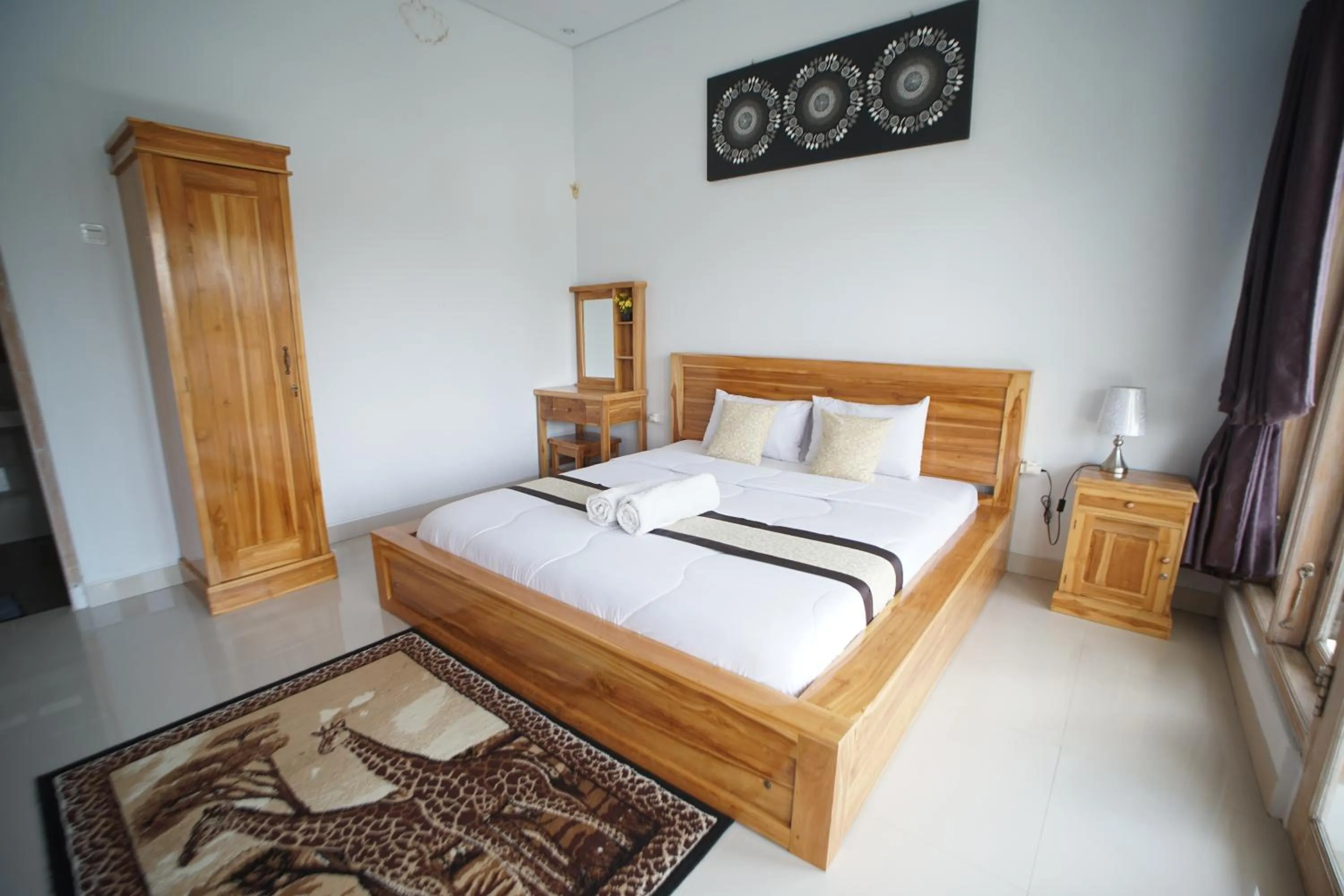 Bed in Batur Pyramid Guesthouse