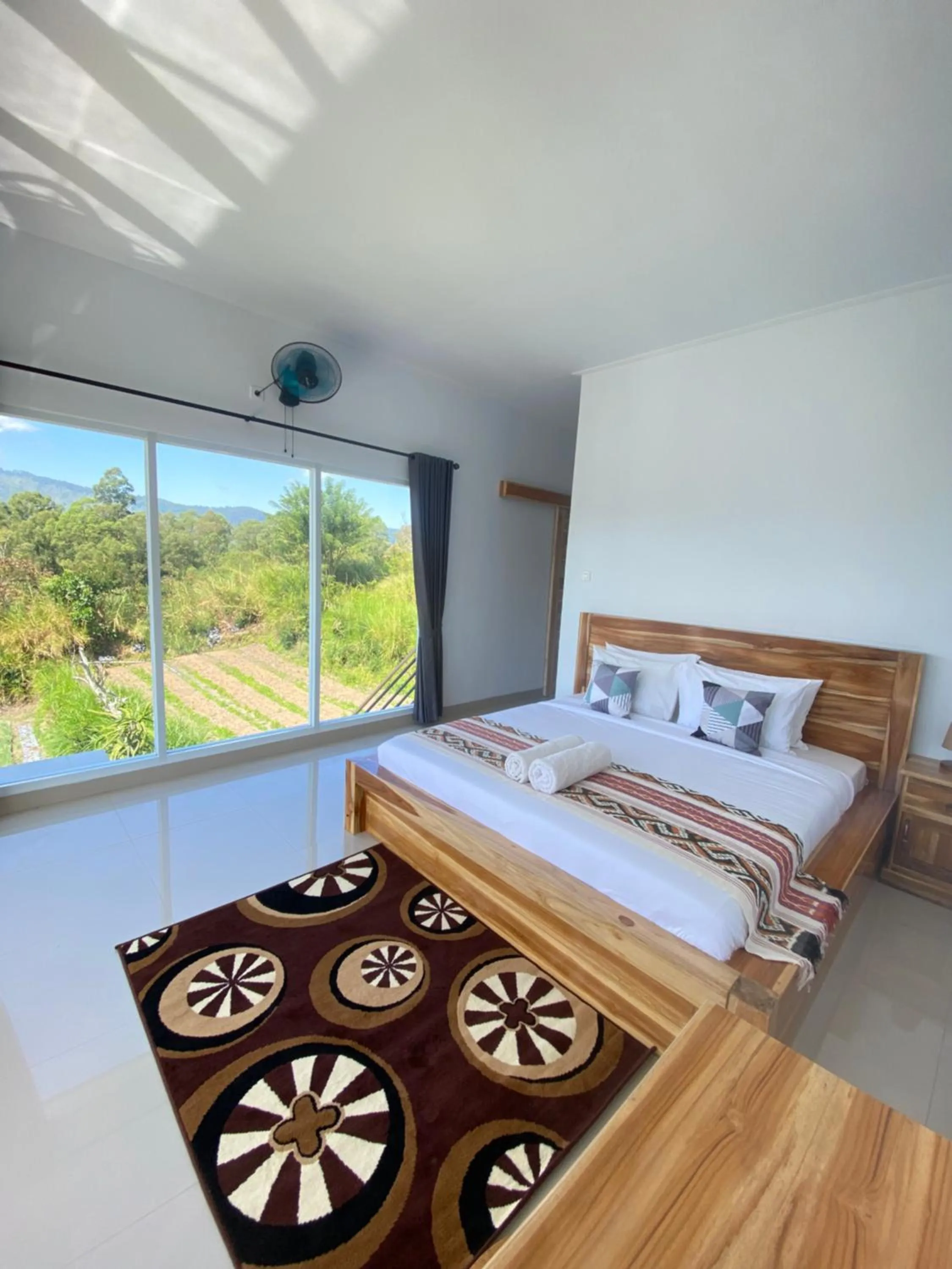 Bed in Batur Pyramid Guesthouse