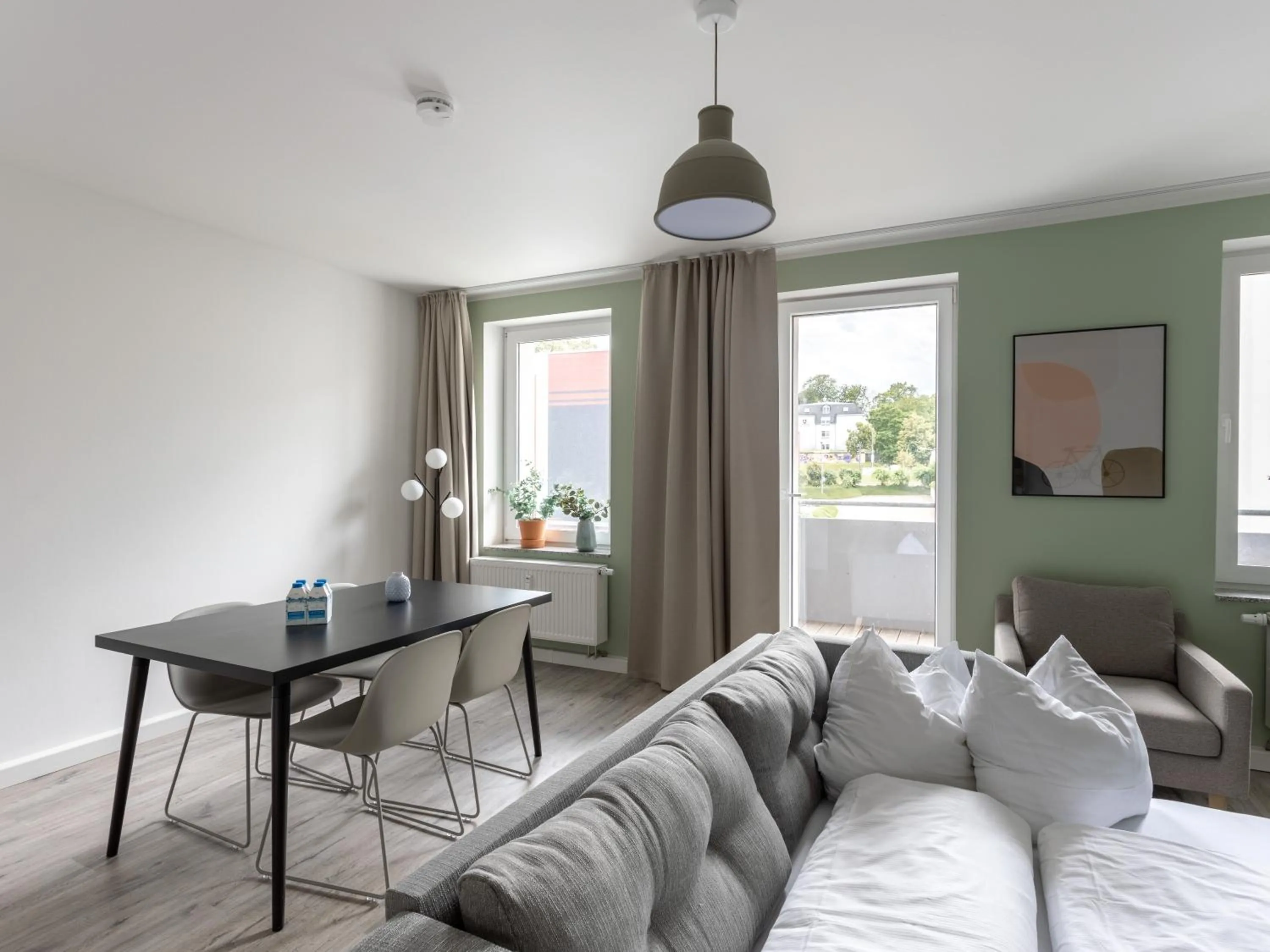 Seating area, Bed in Limehome Chemnitz Hartmannstraße