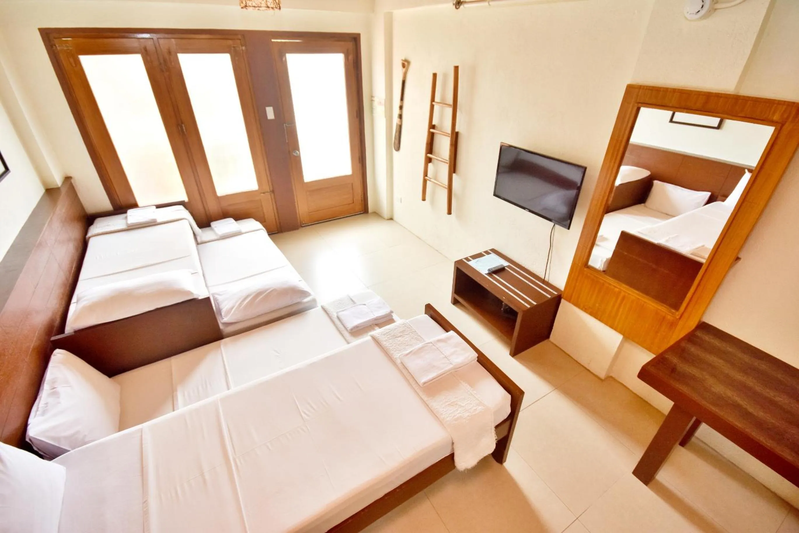 Photo of the whole room, Bed in Agos Boracay Rooms + Beds