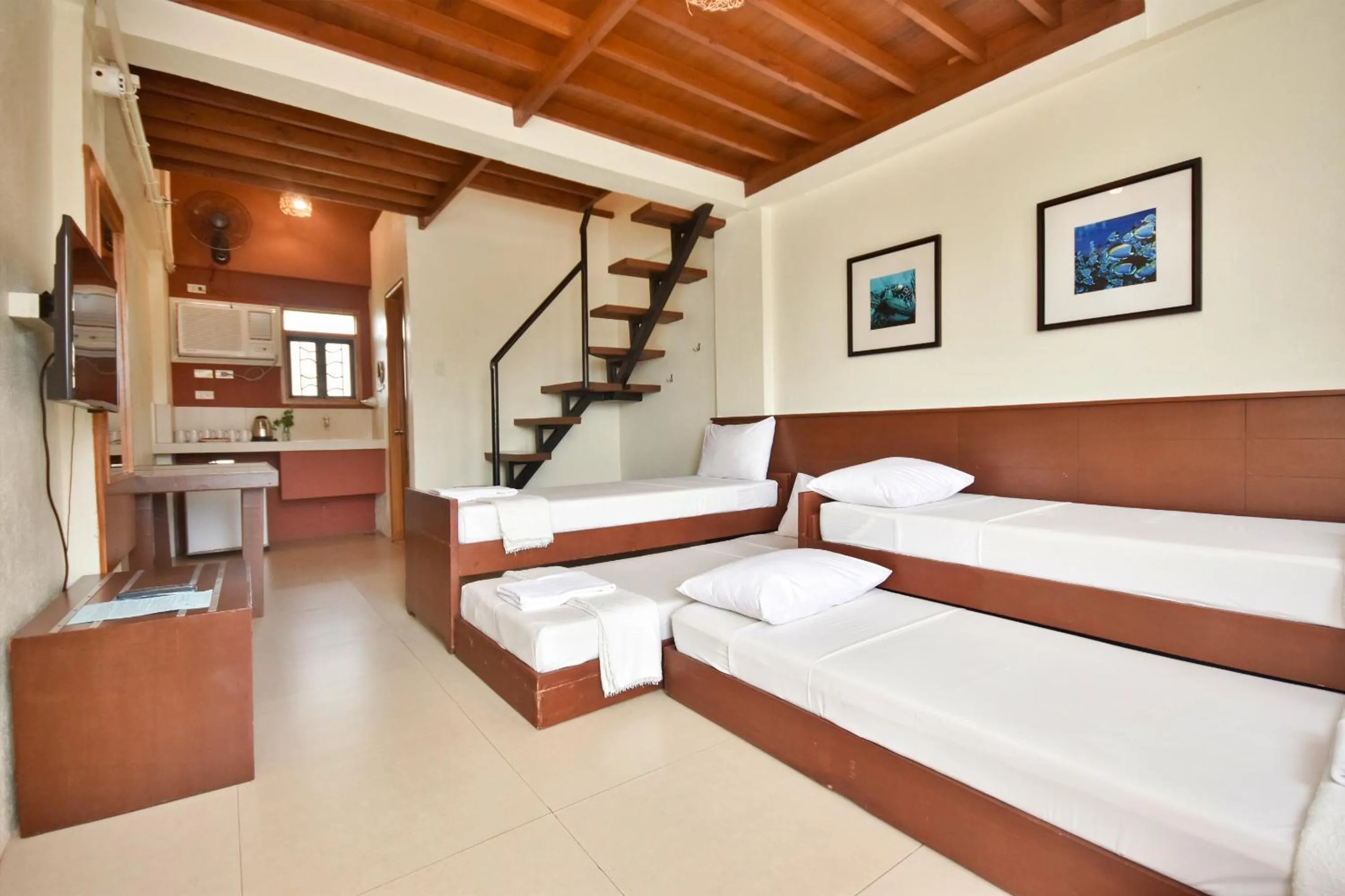 Photo of the whole room, Bed in Agos Boracay Rooms + Beds