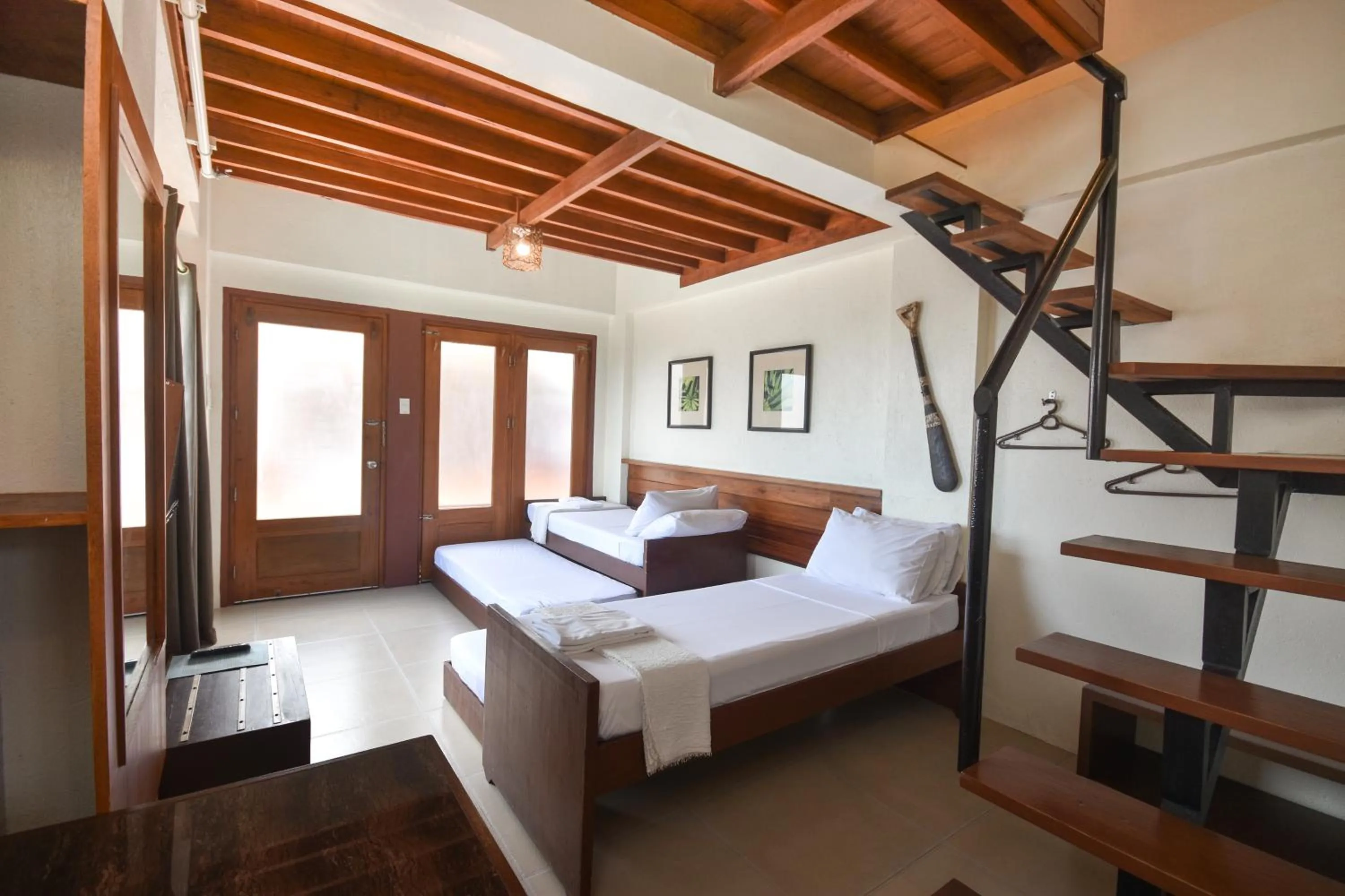 Photo of the whole room, Bed in Agos Boracay Rooms + Beds