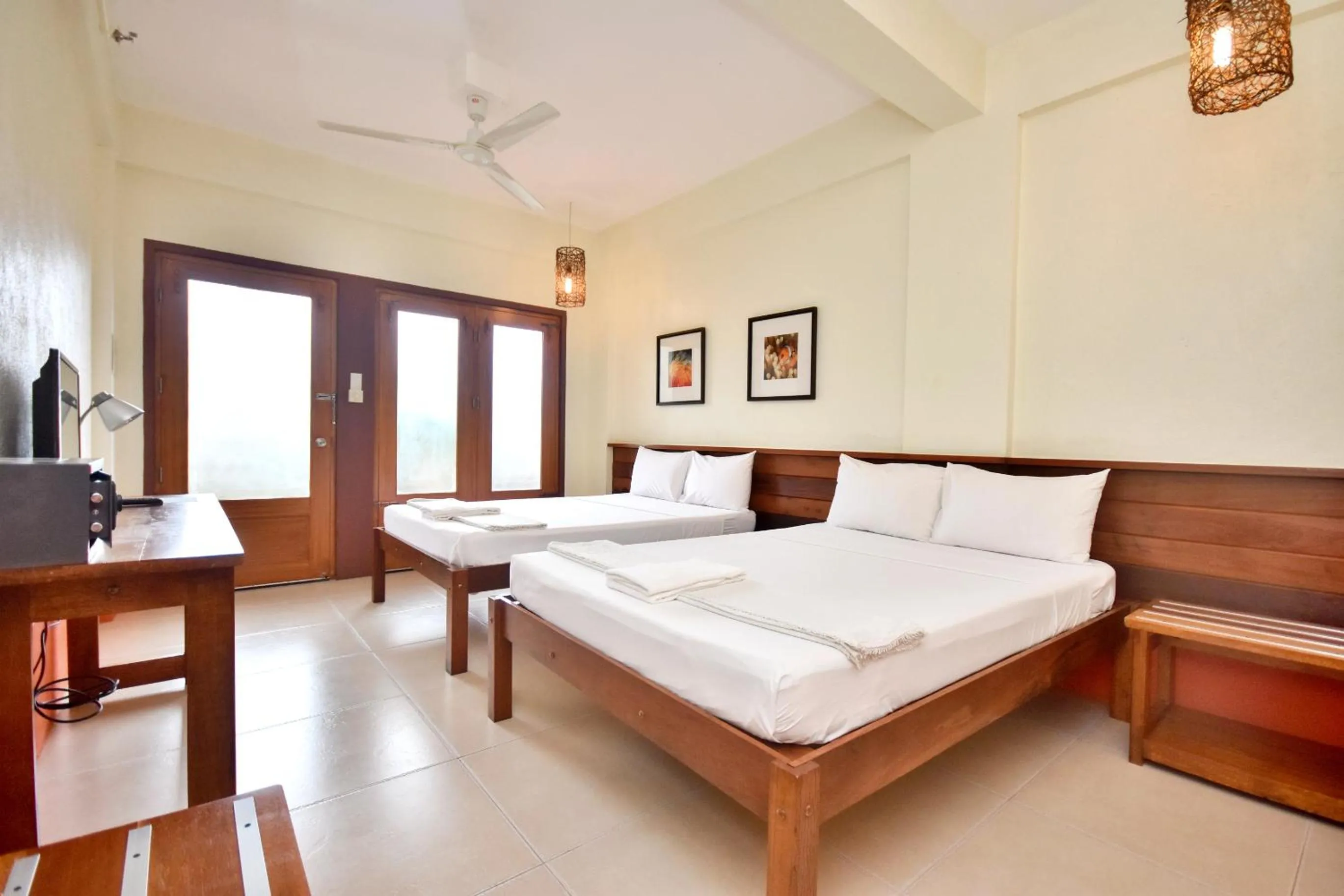 Photo of the whole room, Bed in Agos Boracay Rooms + Beds