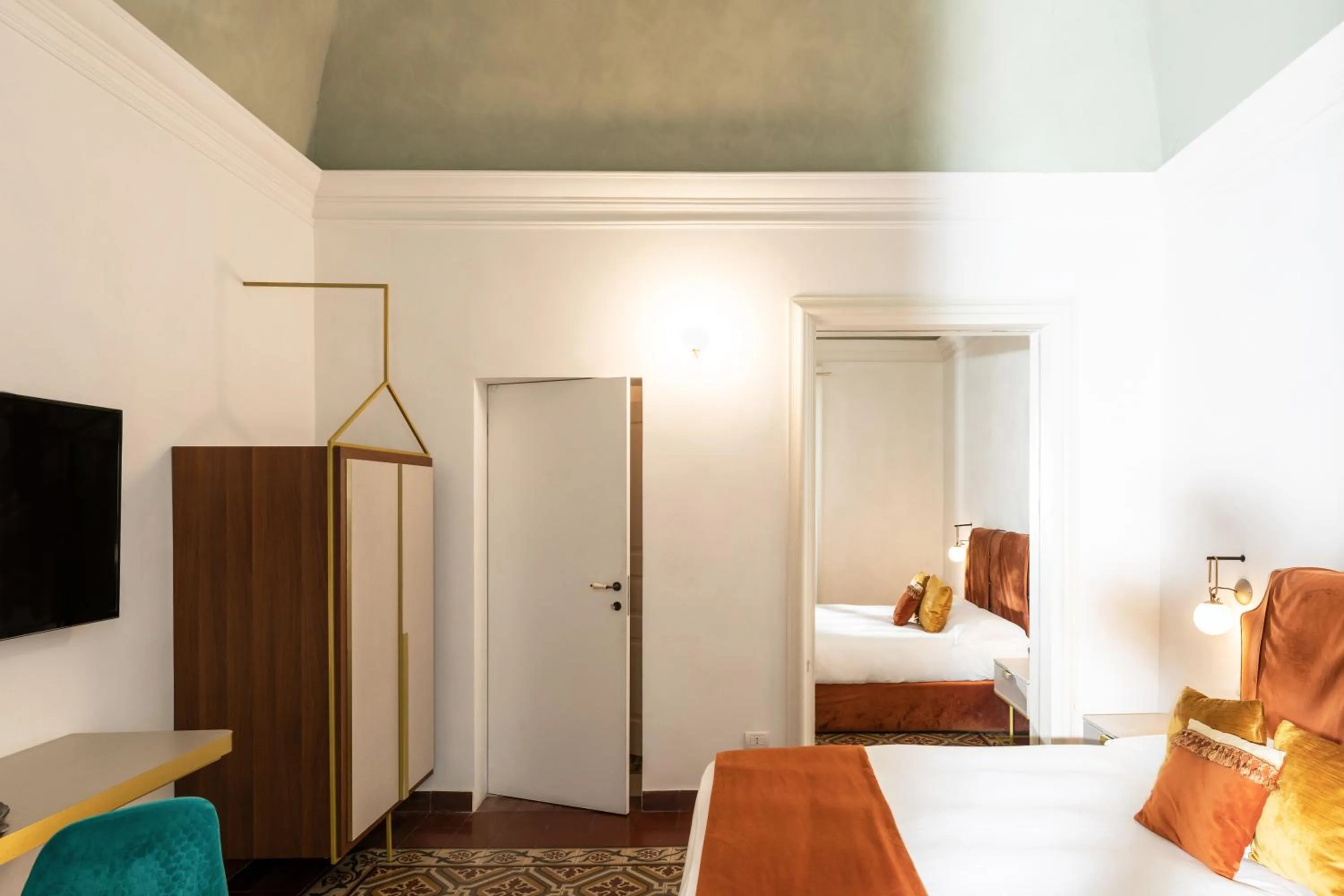 Bed in Scene Suites Apartments