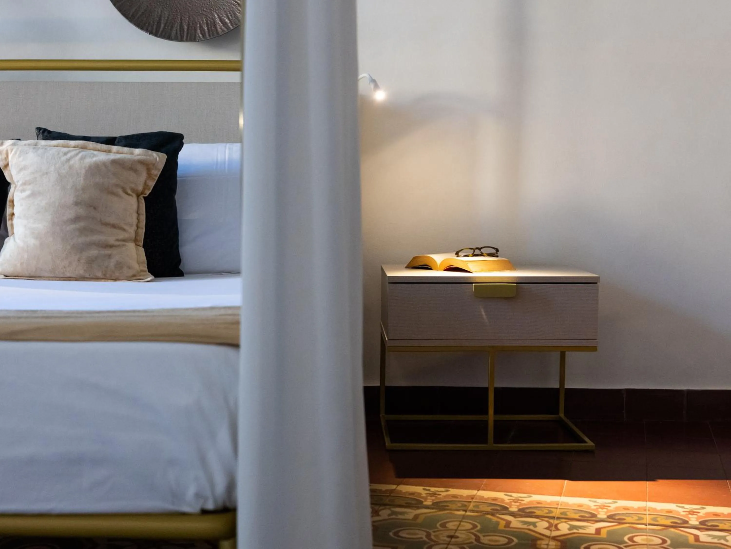 Bed in Scene Suites Apartments