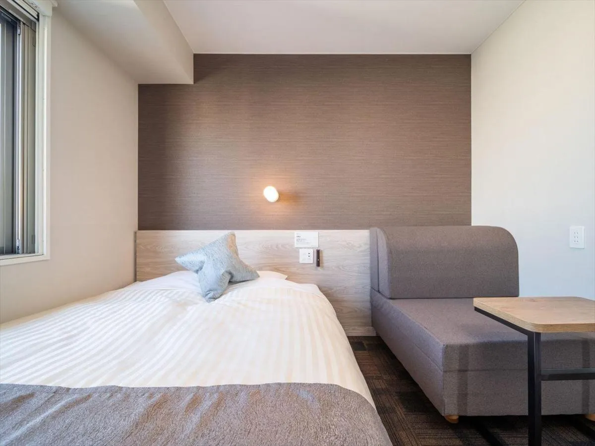 Bed in Super Hotel Premier Saitama Higashiguchi