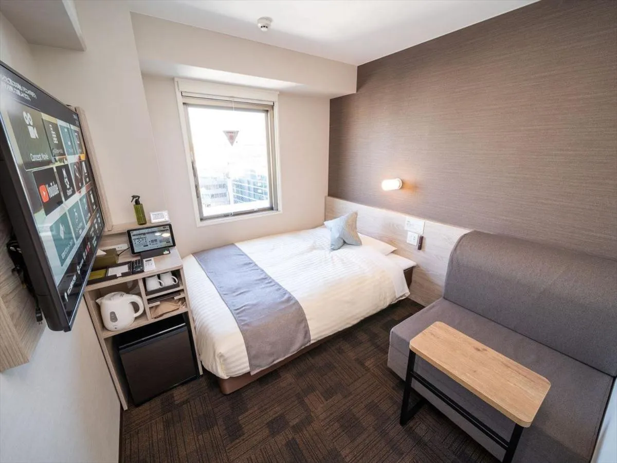 Bed in Super Hotel Premier Saitama Higashiguchi