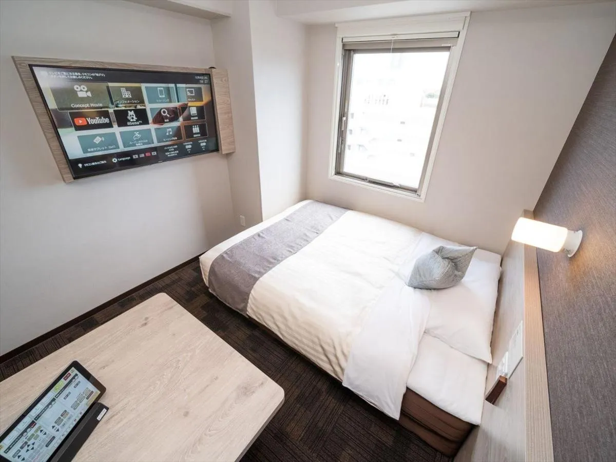 Bed in Super Hotel Premier Saitama Higashiguchi