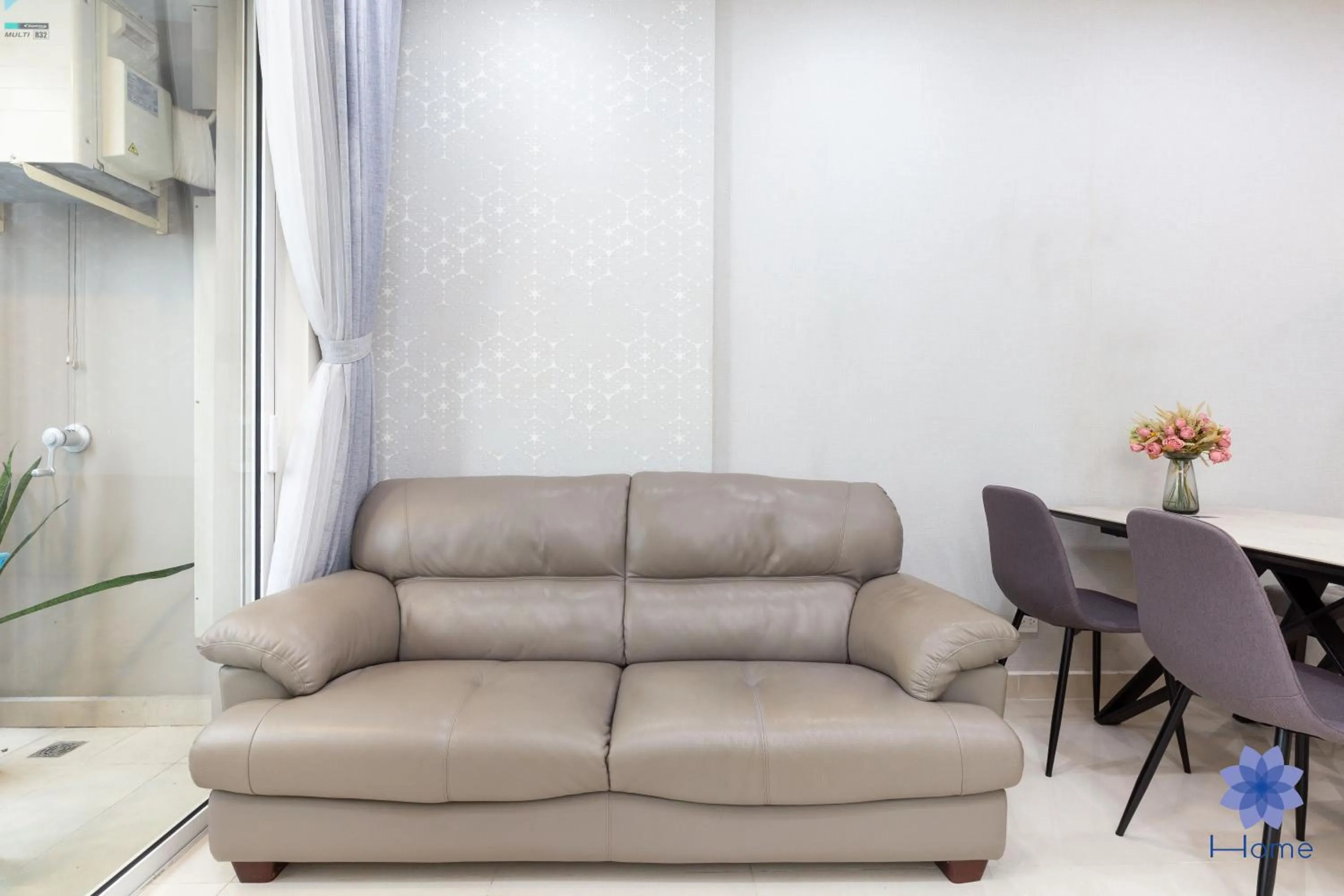 Living room in iHome Furnished Apartments with Free Gym & Pool, Airport Pick-Up Service