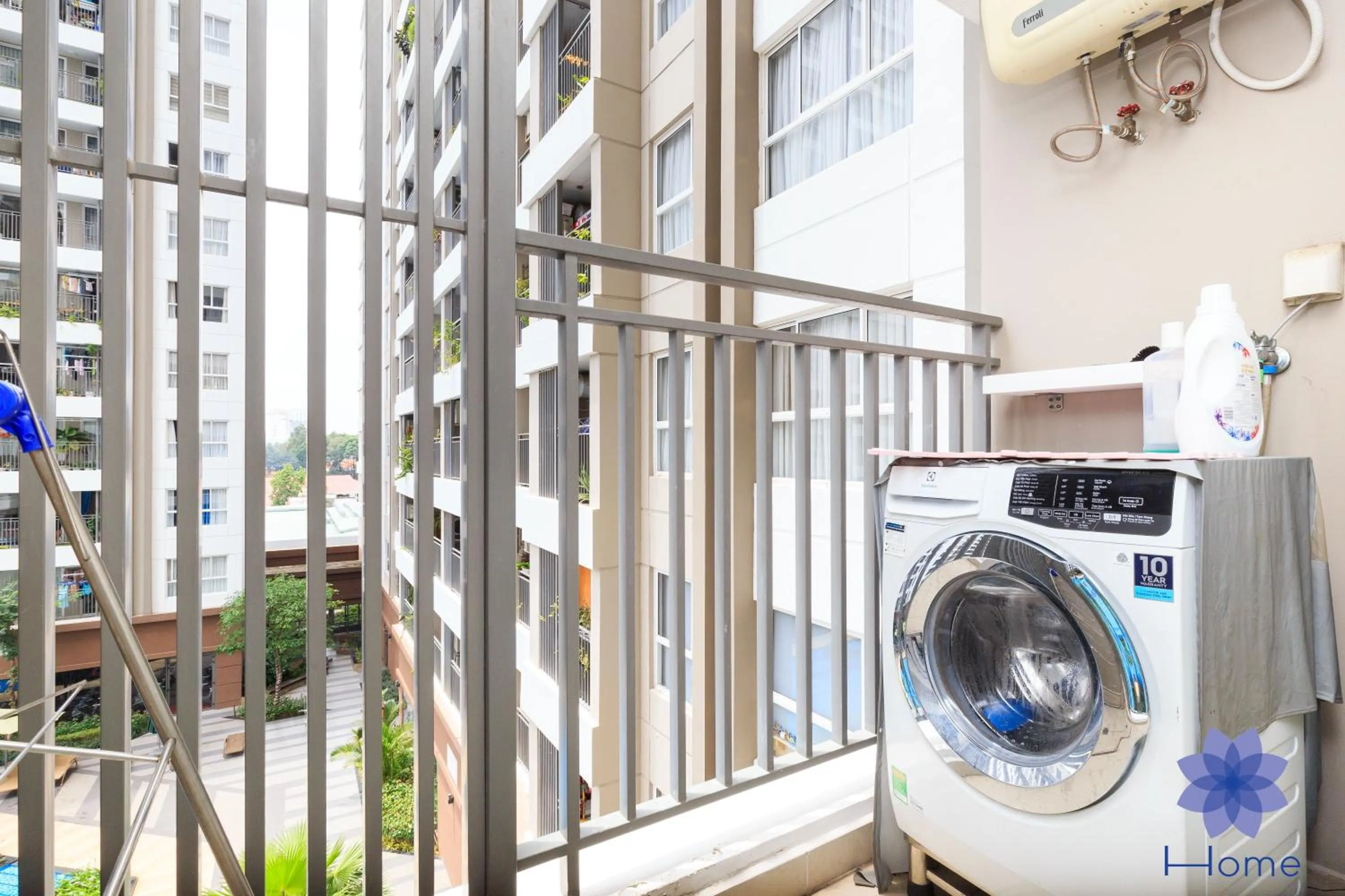 washing machine in iHome Furnished Apartments with Free Gym & Pool, Airport Pick-Up Service