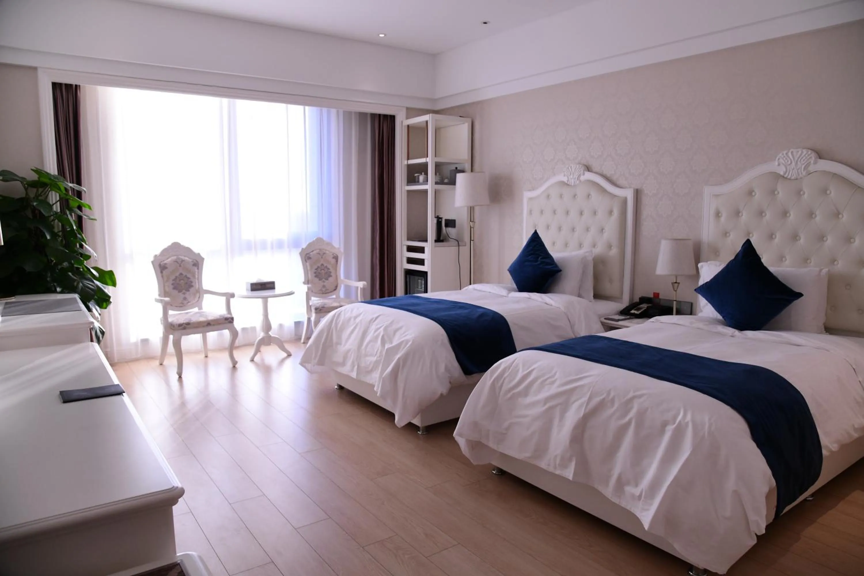 Bed in GUOCE Beijing Capital Airport Hotel & Convention Center