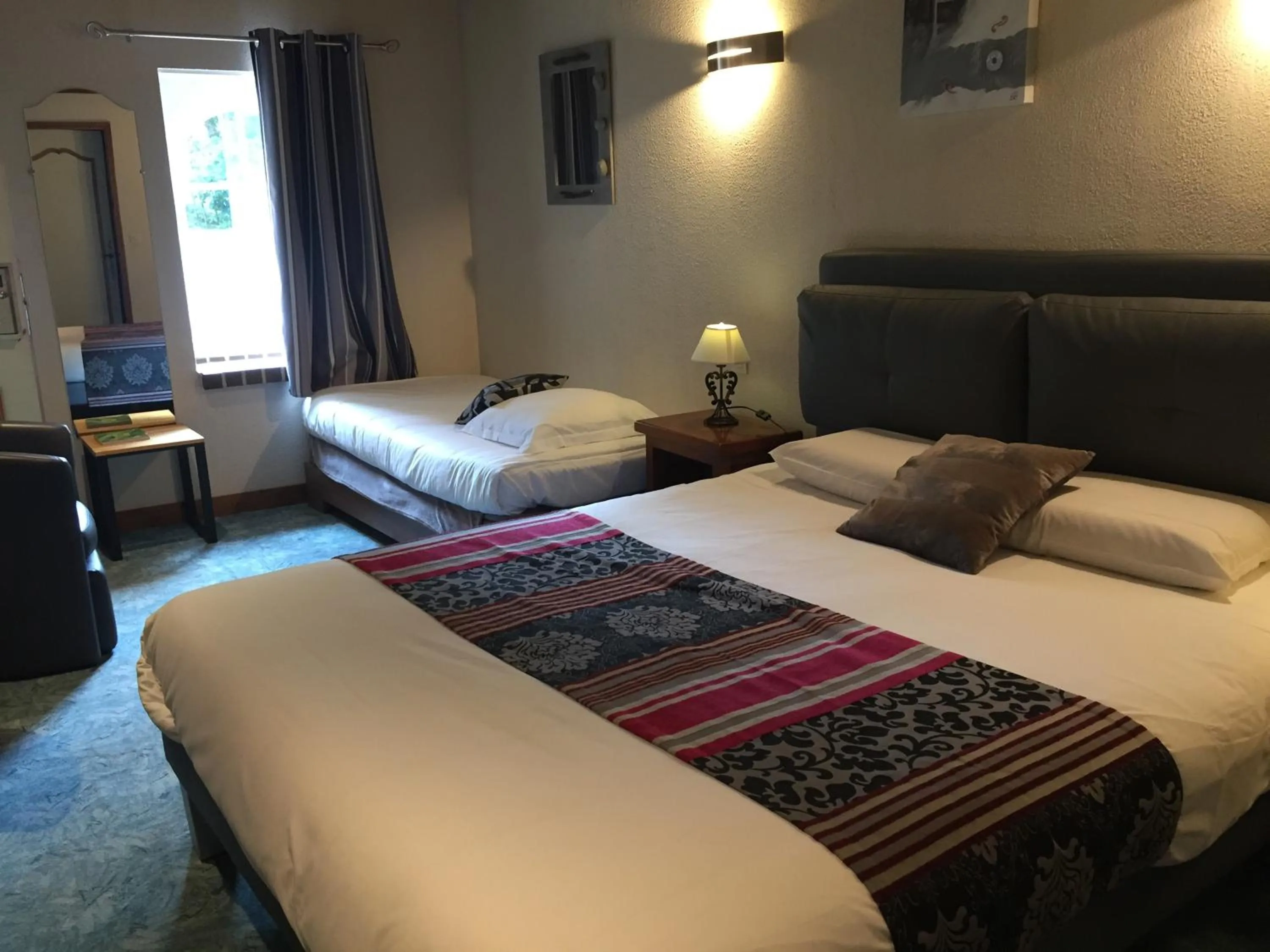 Photo of the whole room, Bed in Logis Hotel Oasis