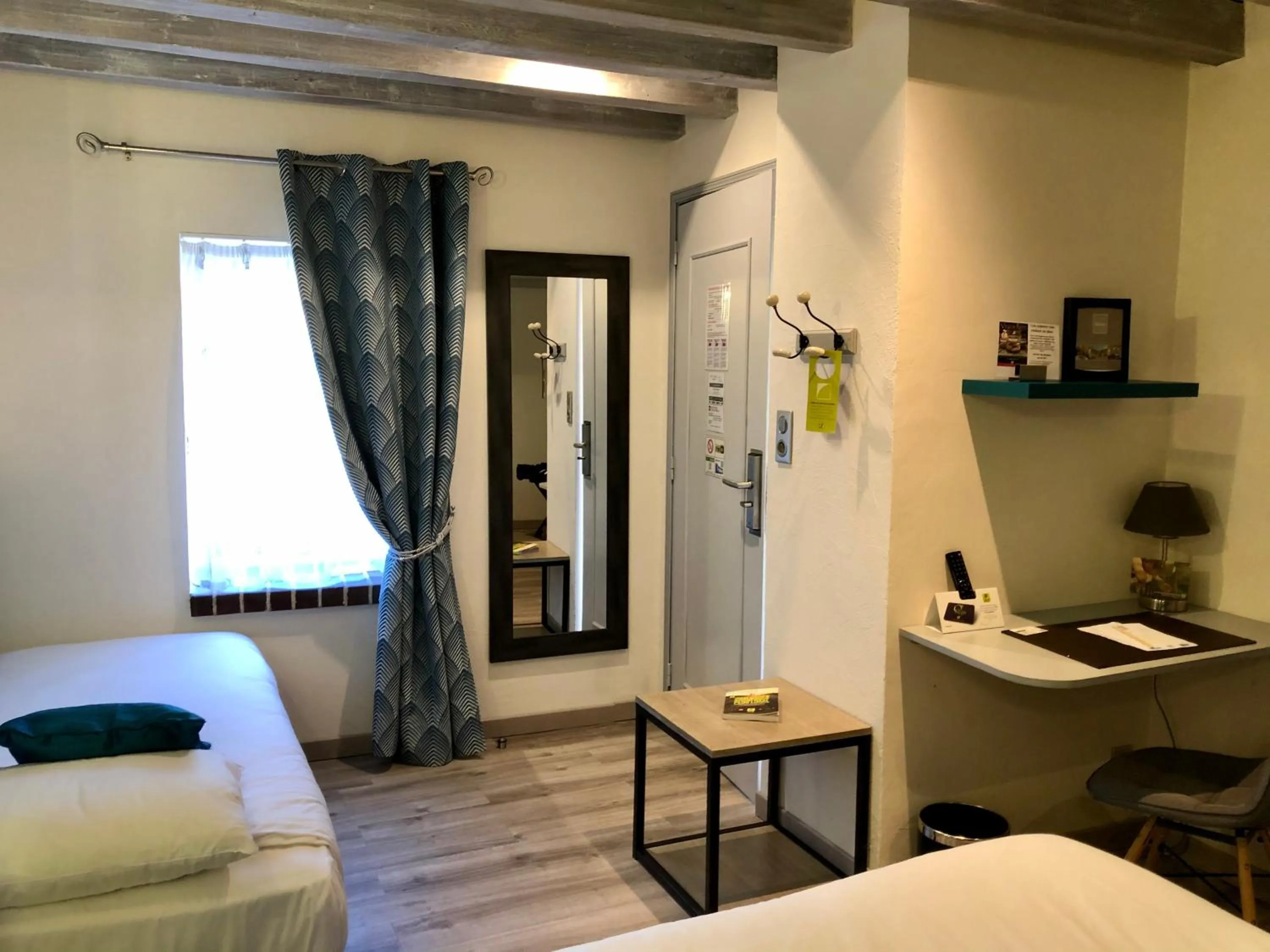 Seating area, Bed in Logis Hotel Oasis