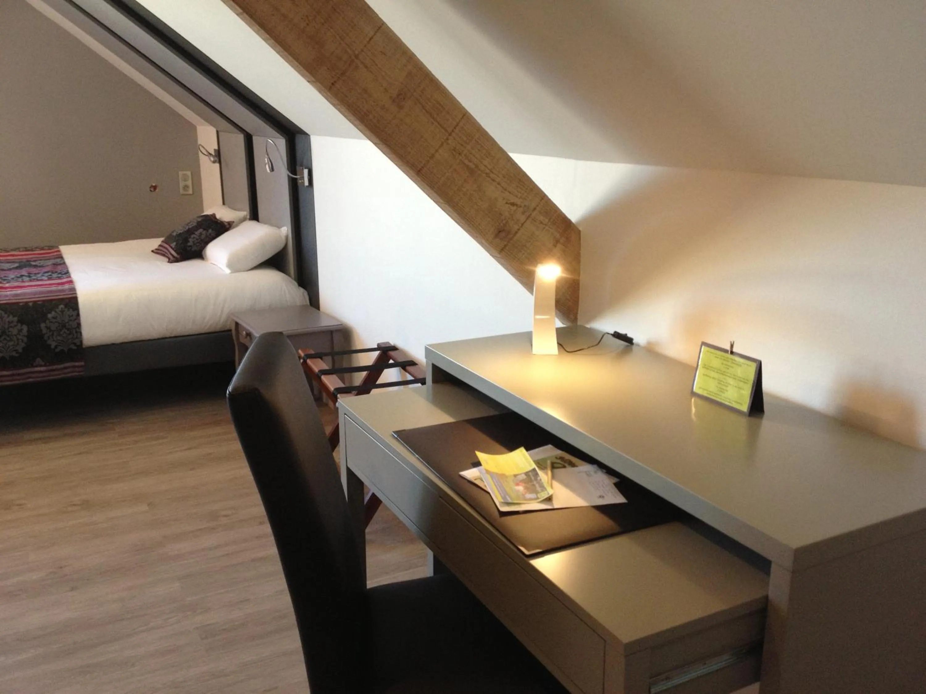 Seating area, Bed in Logis Hotel Oasis