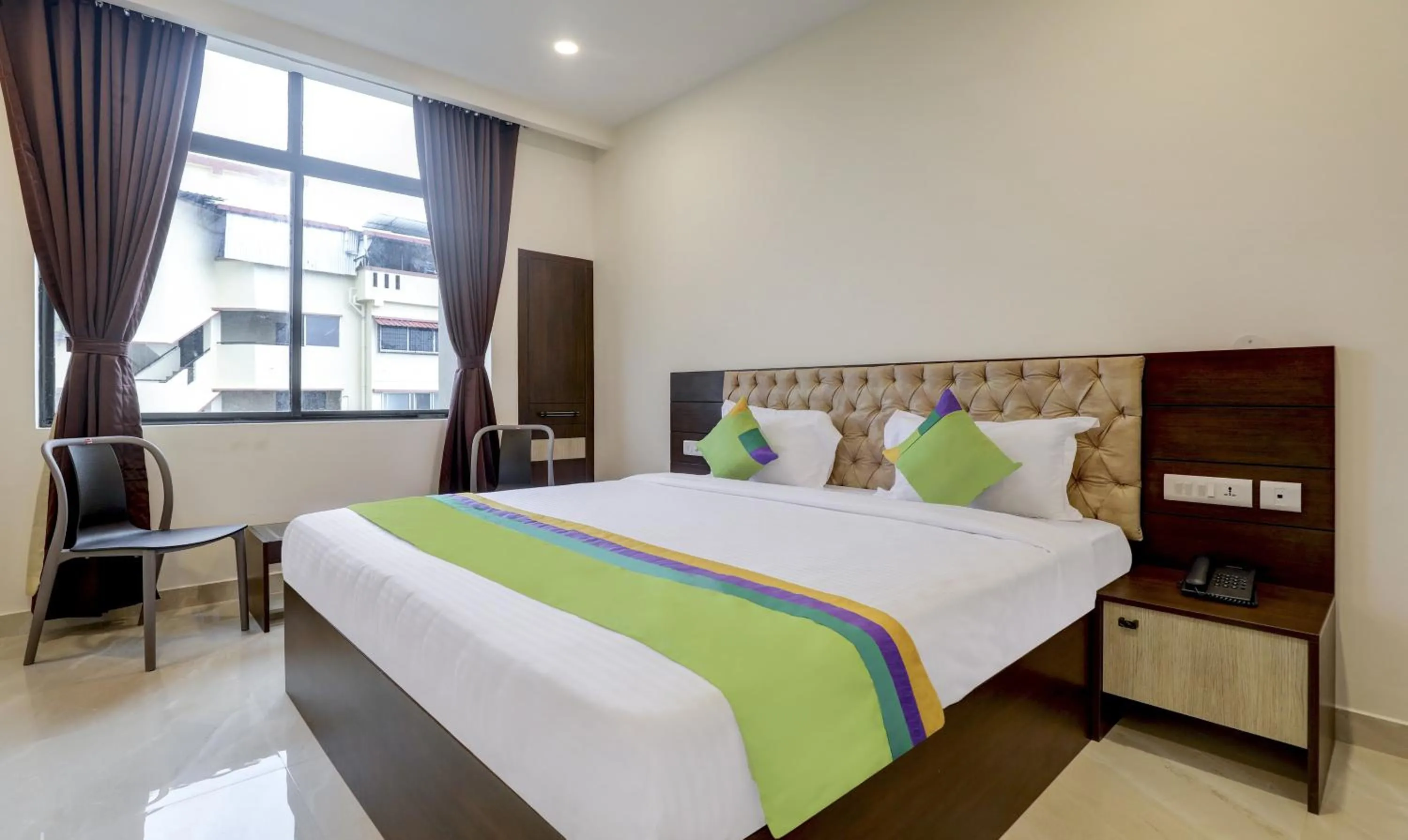 Photo of the whole room, Bed in Treebo The Horizon Kankanady