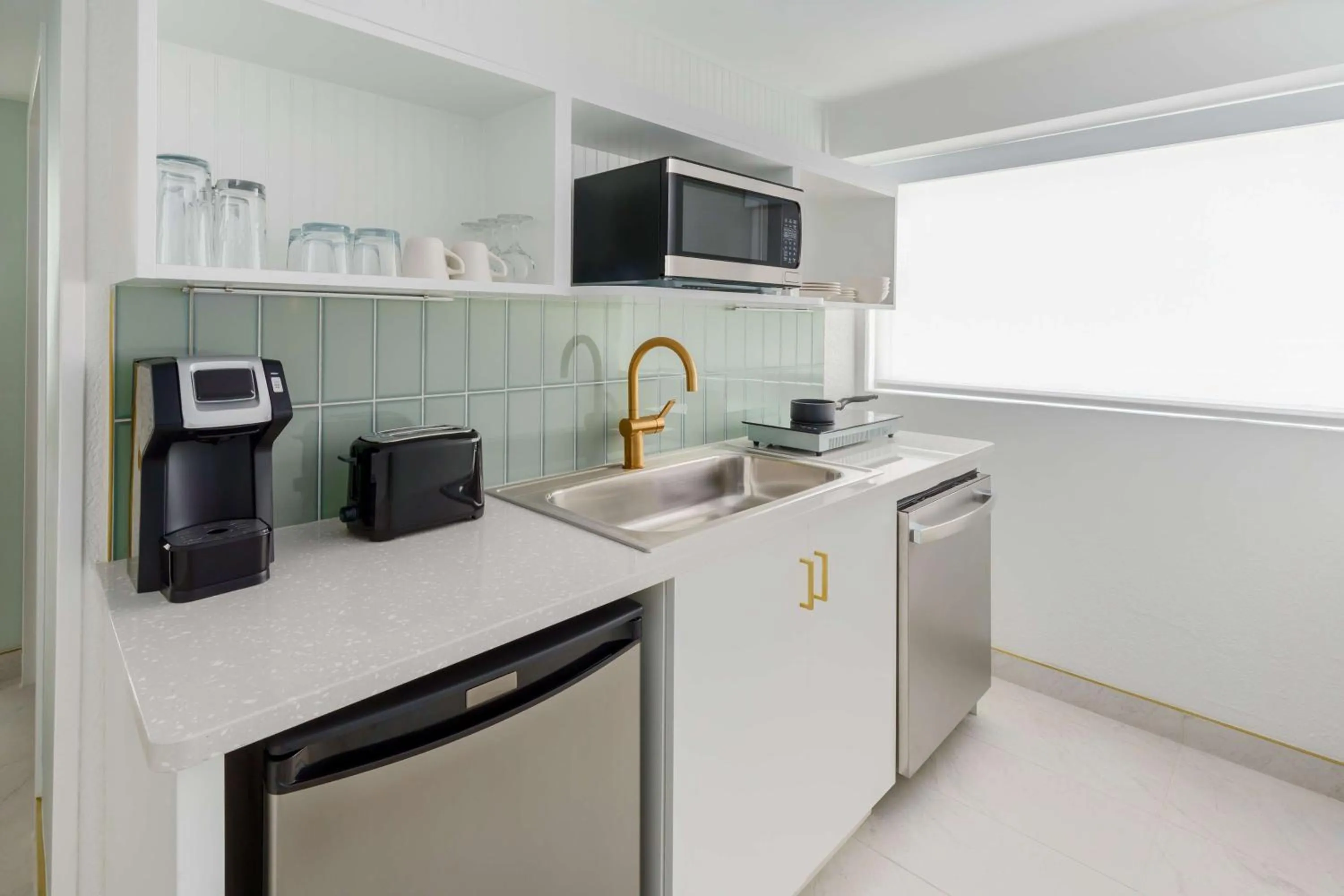 Kitchen or kitchenette in Beal House Fort Walton Beach, Tapestry Collection By Hilton