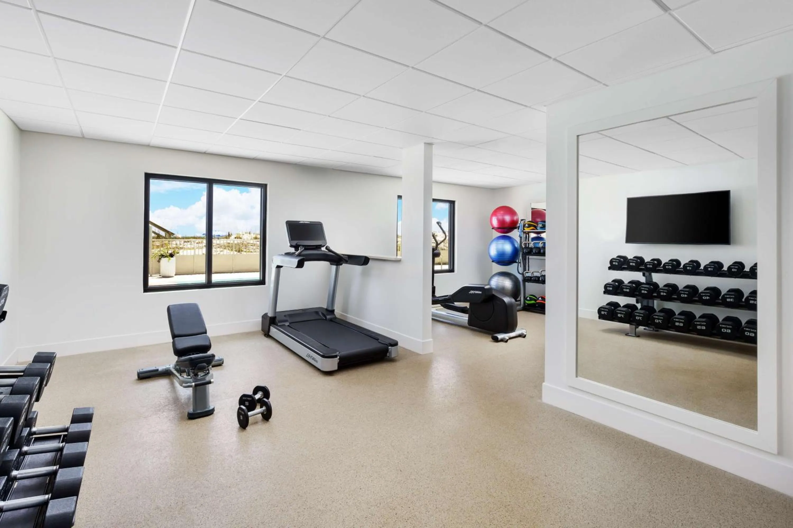 Fitness centre/facilities in Beal House Fort Walton Beach, Tapestry Collection By Hilton
