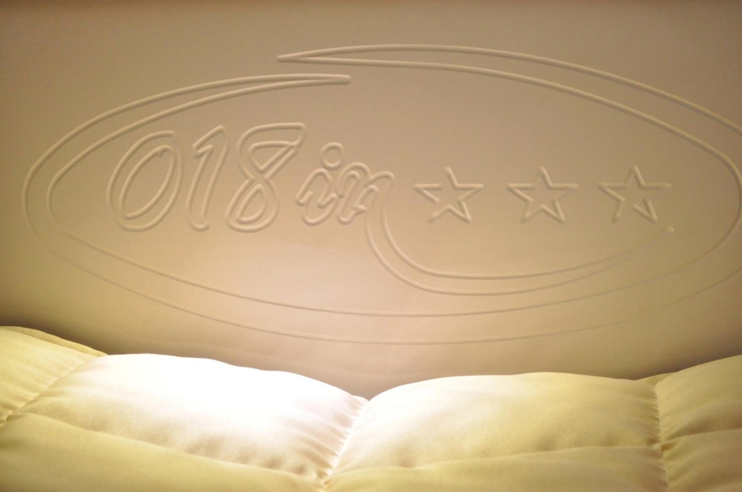 Bed in Garni Hotel 018 In