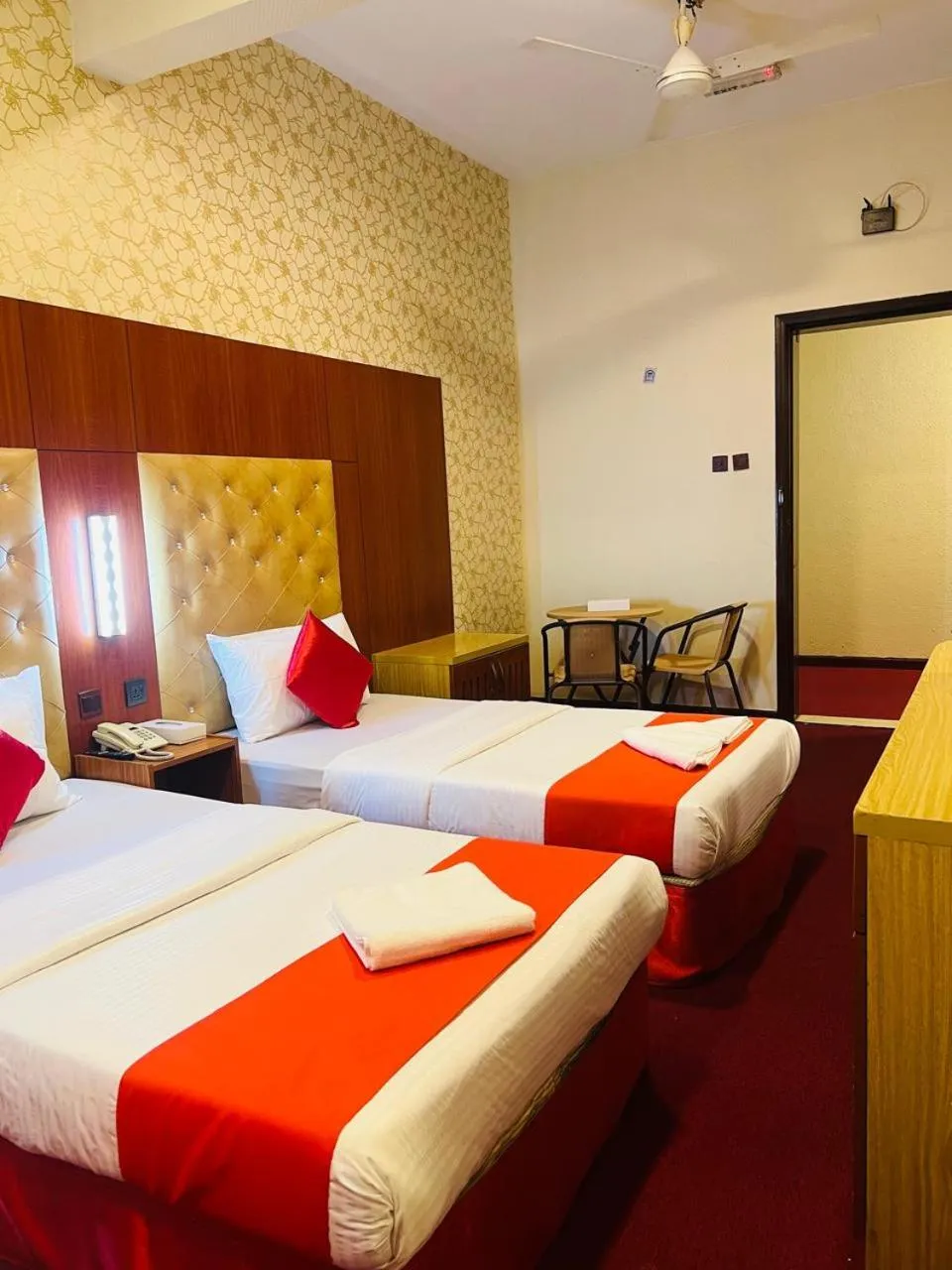 Bed in Parasol Hotel