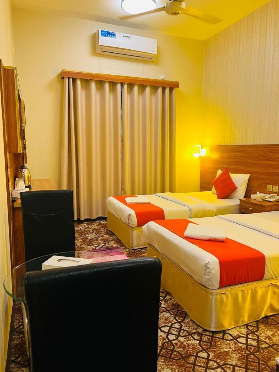 Bed in Parasol Hotel