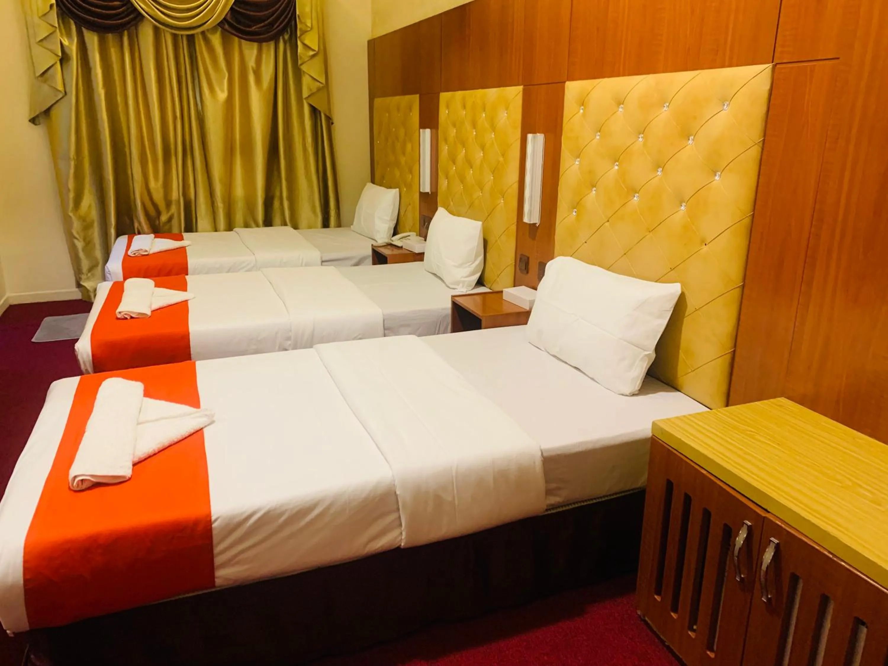 Bed in Parasol Hotel