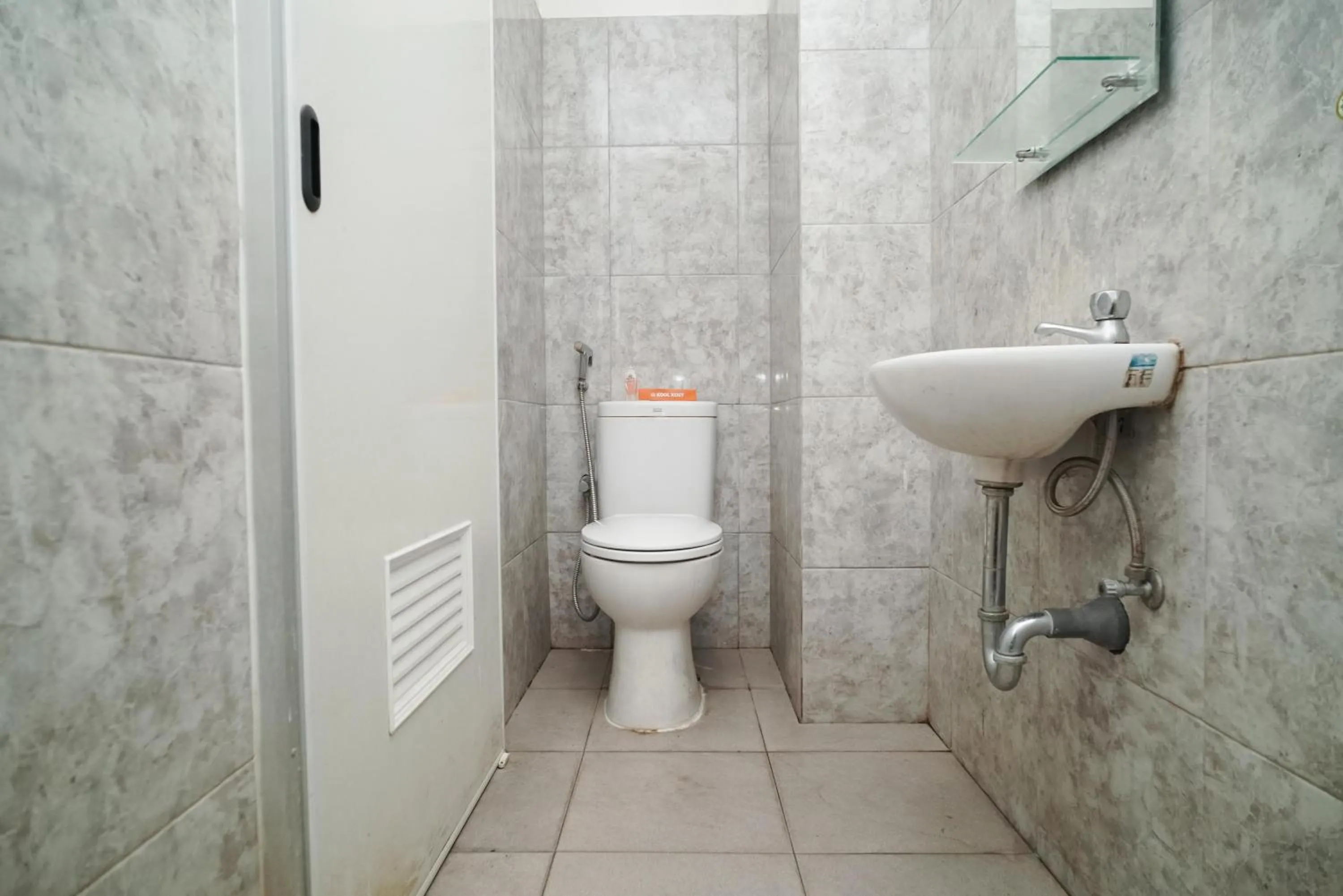 Bathroom in KoolKost near Universitas BINUS Anggrek