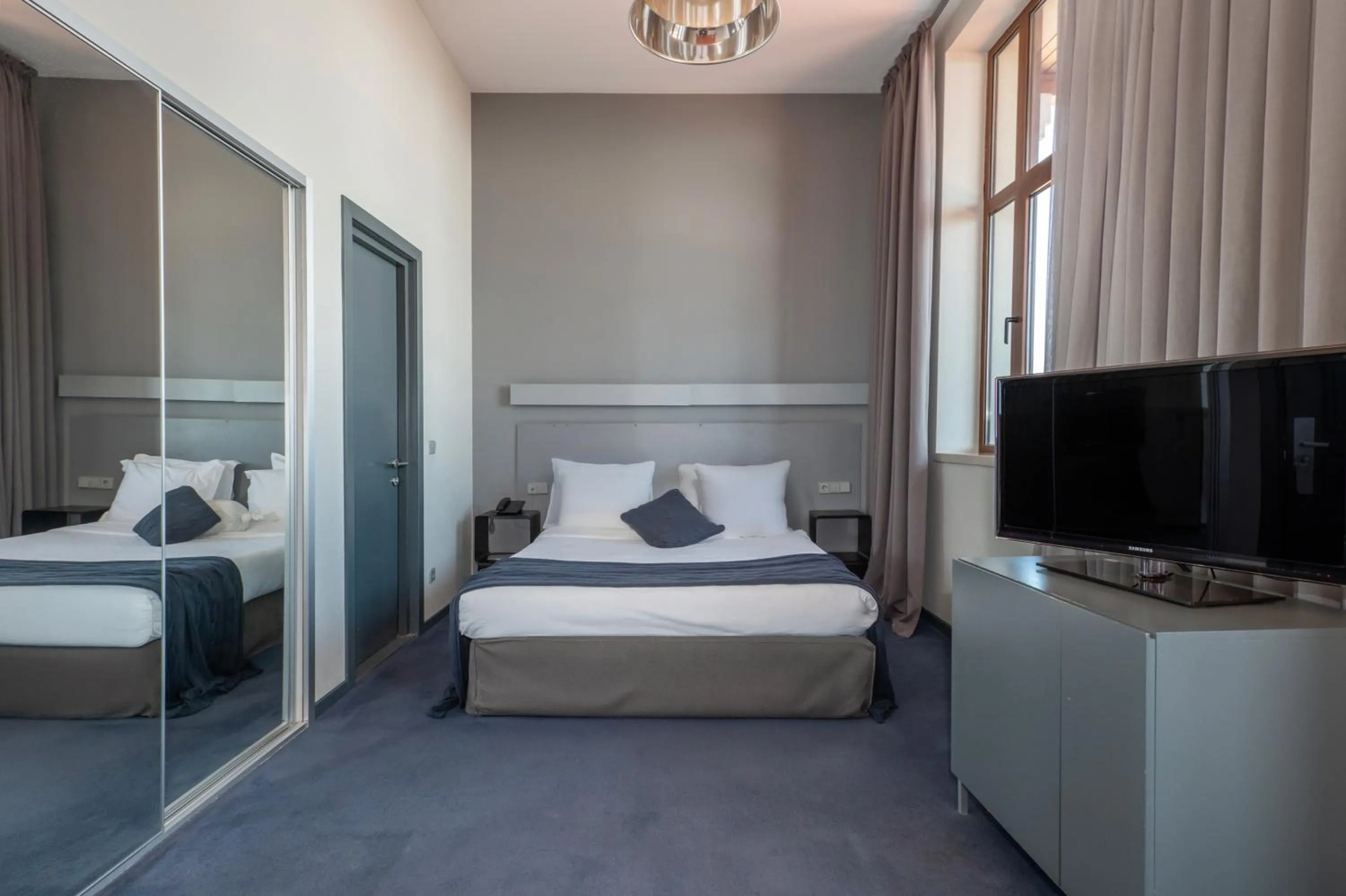 Communal lounge/ TV room, Bed in Kabadoni Boutique Hotel