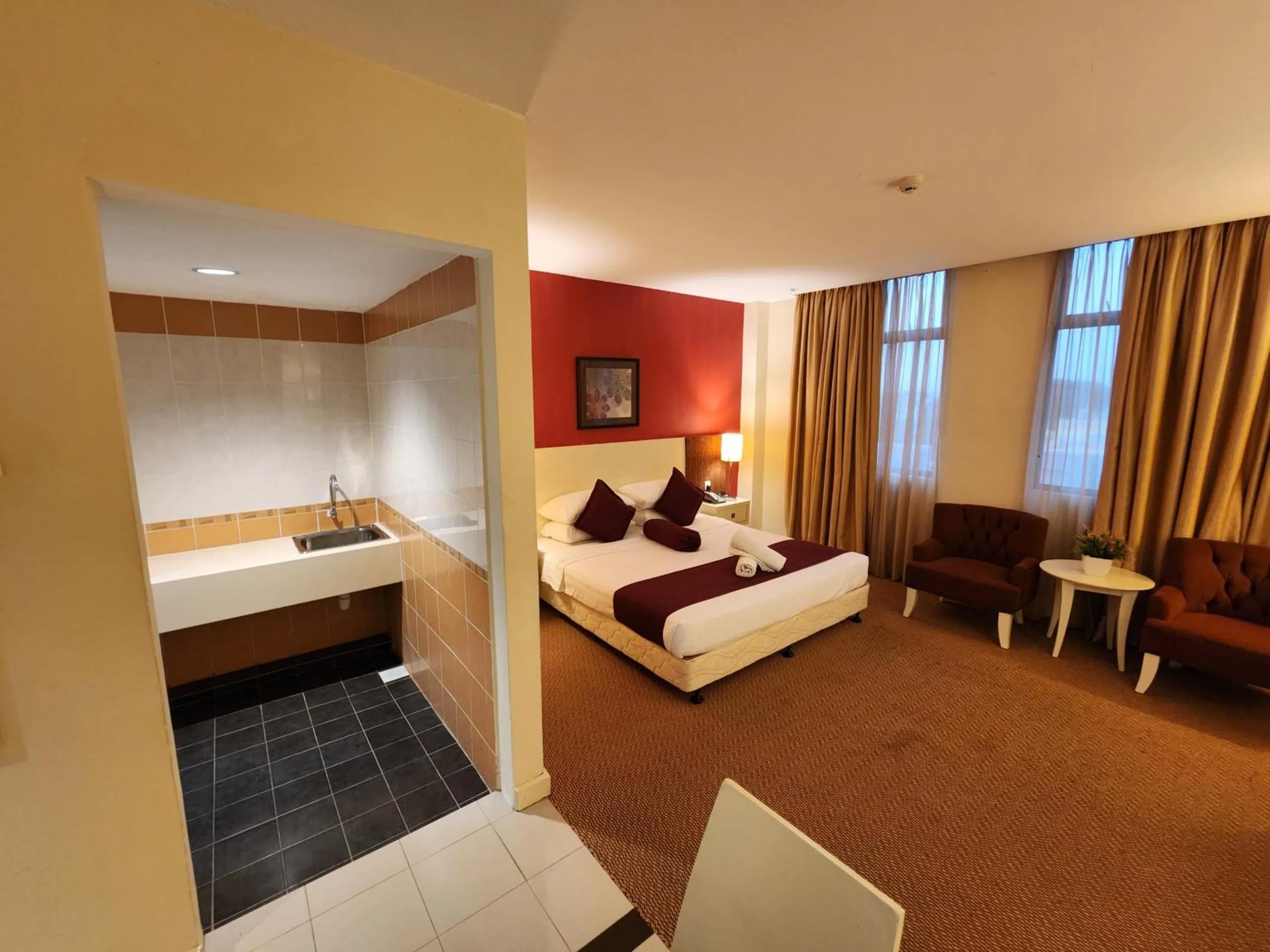 Bed in The Grand Puteri Hotel