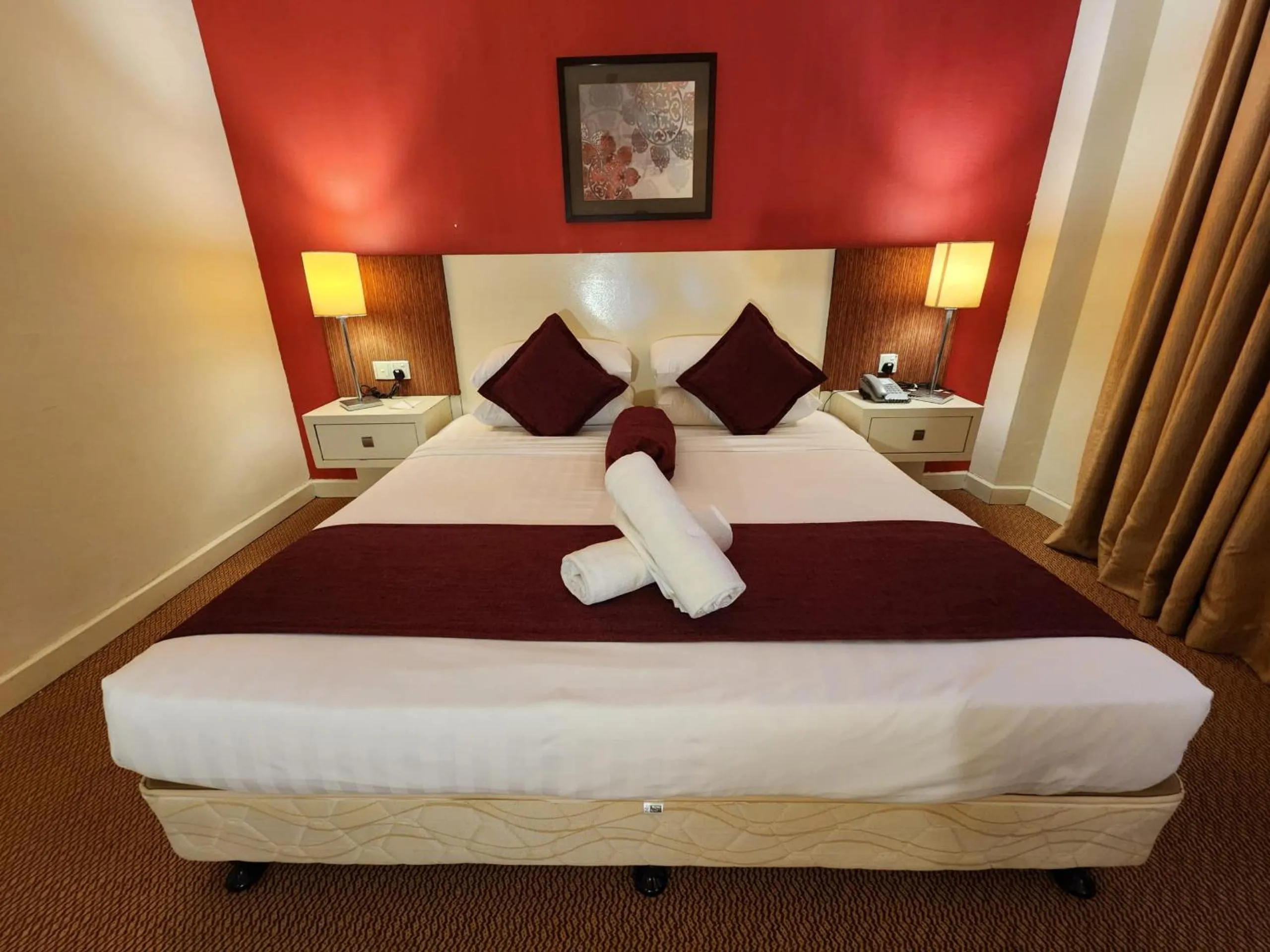 Bed in The Grand Puteri Hotel