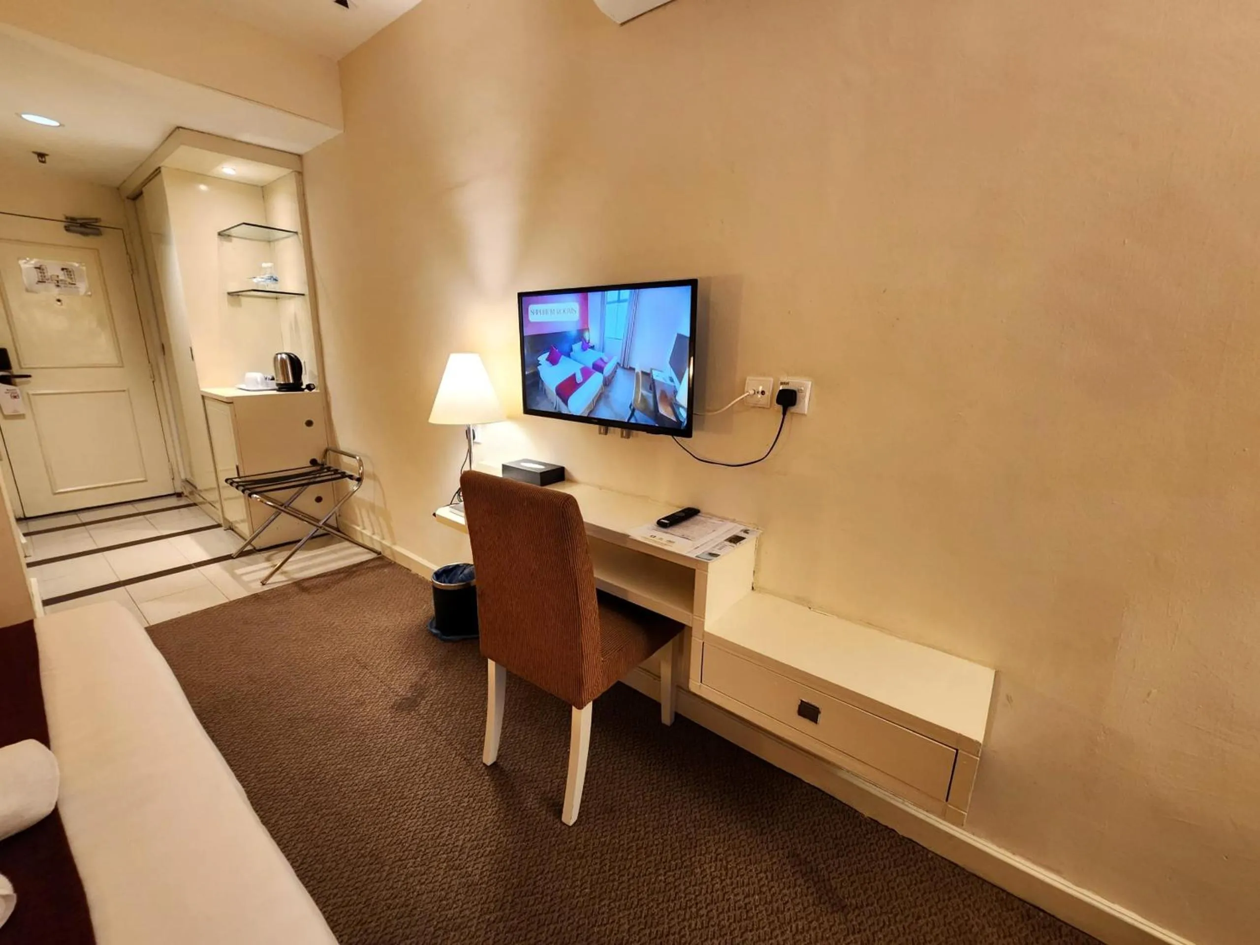 Bedroom in The Grand Puteri Hotel