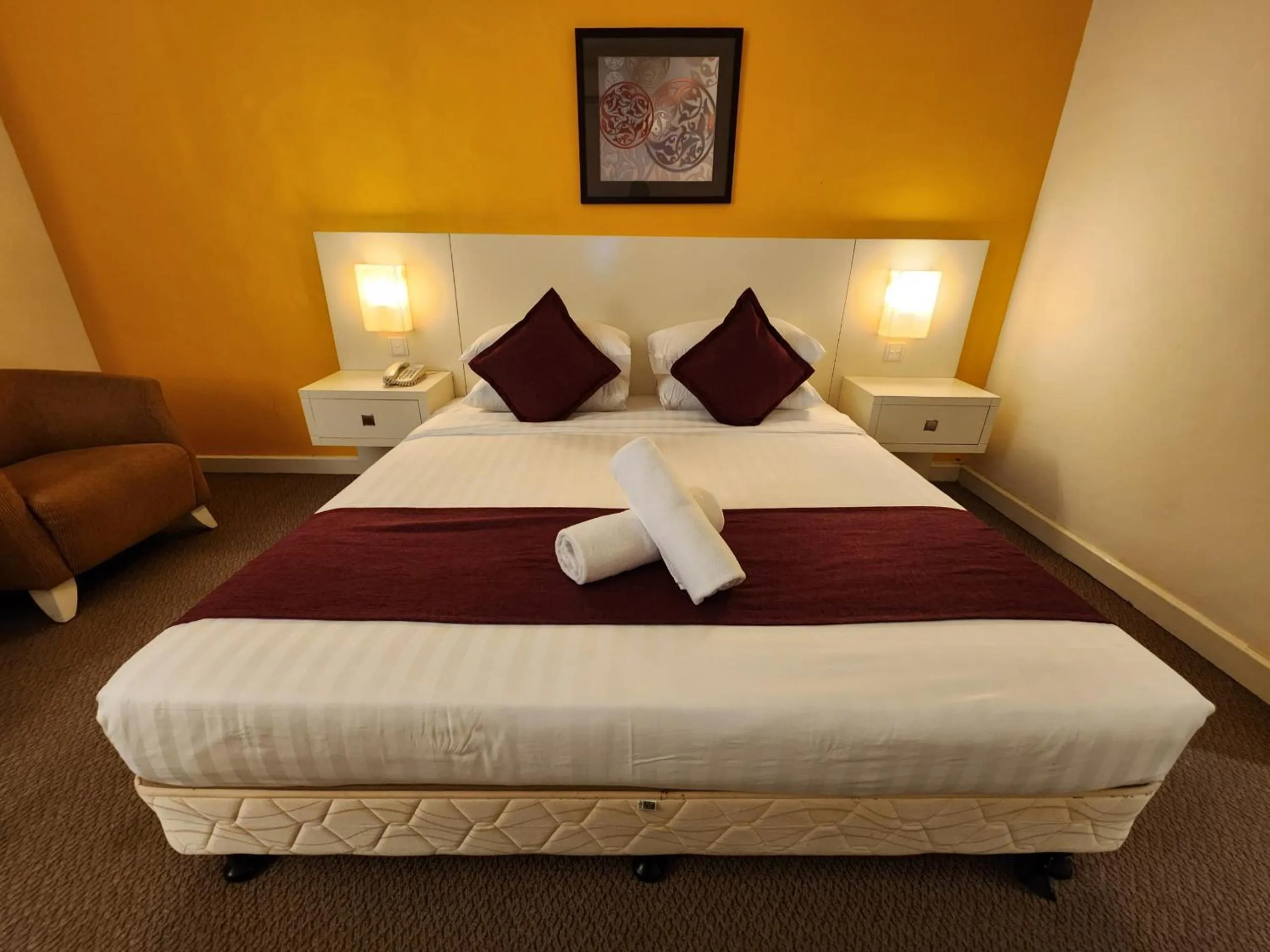 Bed in The Grand Puteri Hotel
