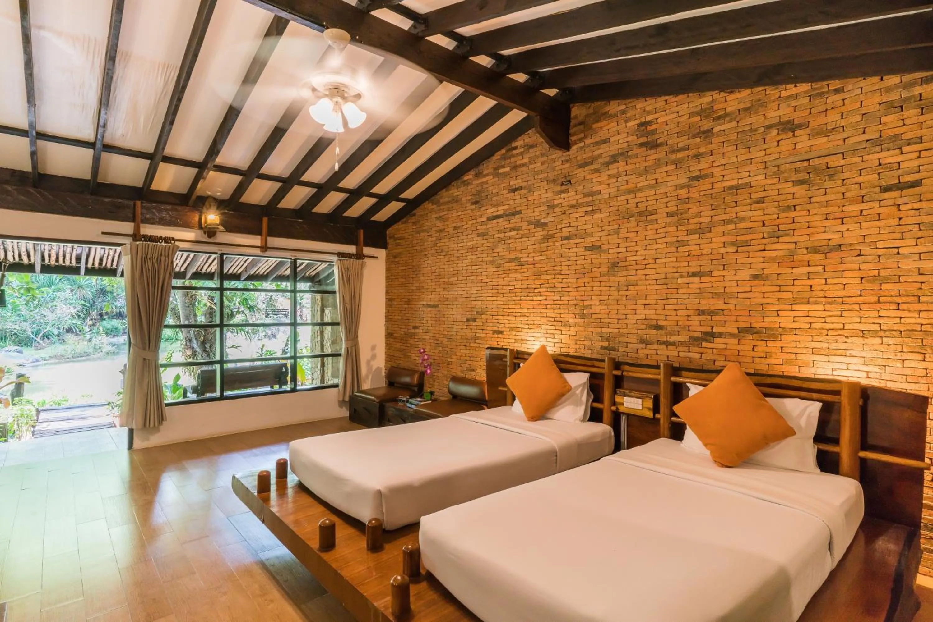 Photo of the whole room, Bed in Home Phutoey River Kwai Hotspring & Nature Resort