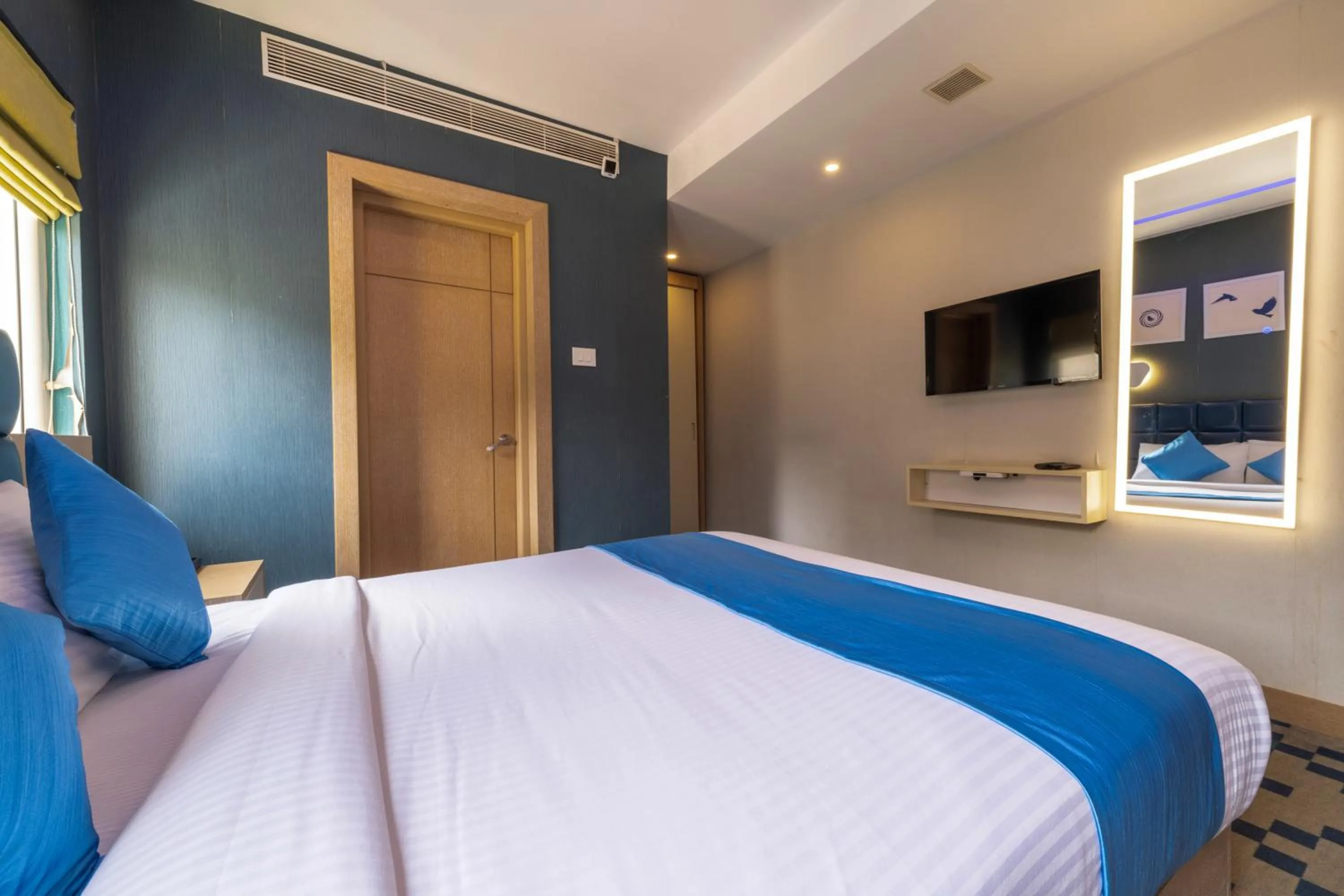 Bed in Mintotel Wayanad