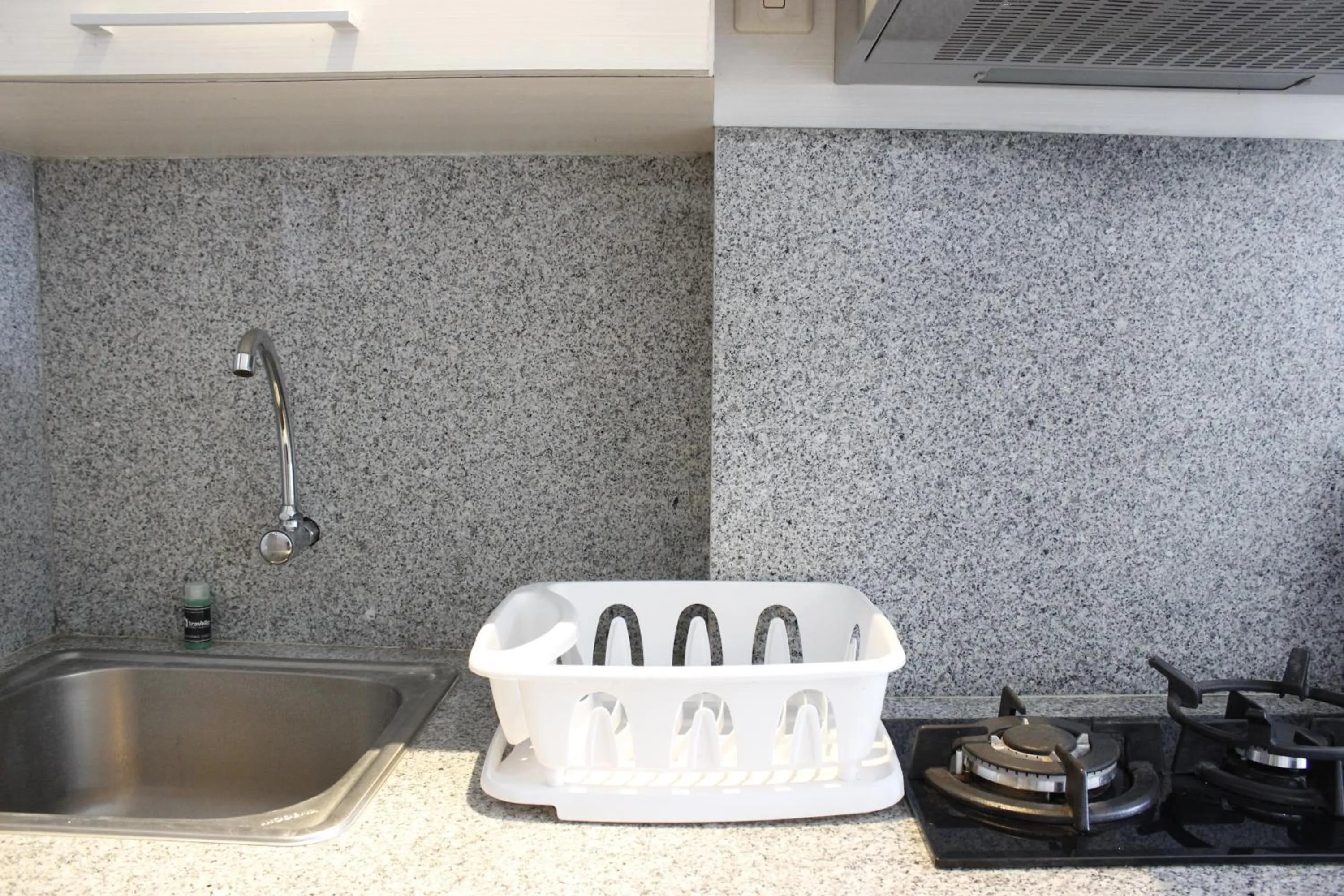 Kitchen or kitchenette in Minimalist Studio Apartment at The Suite @Metro By Travelio