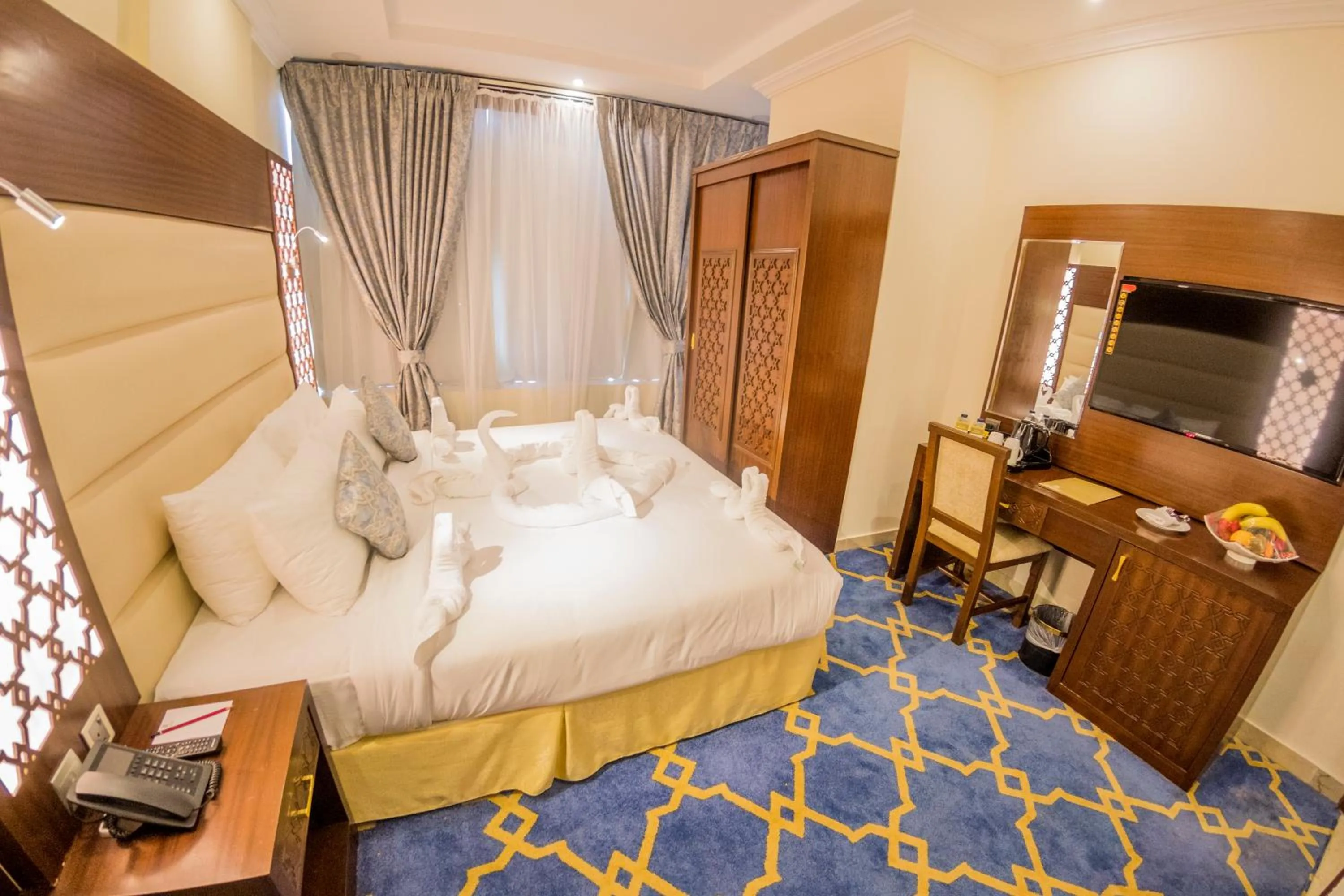 Bed in Jeddah Oasis Hotel