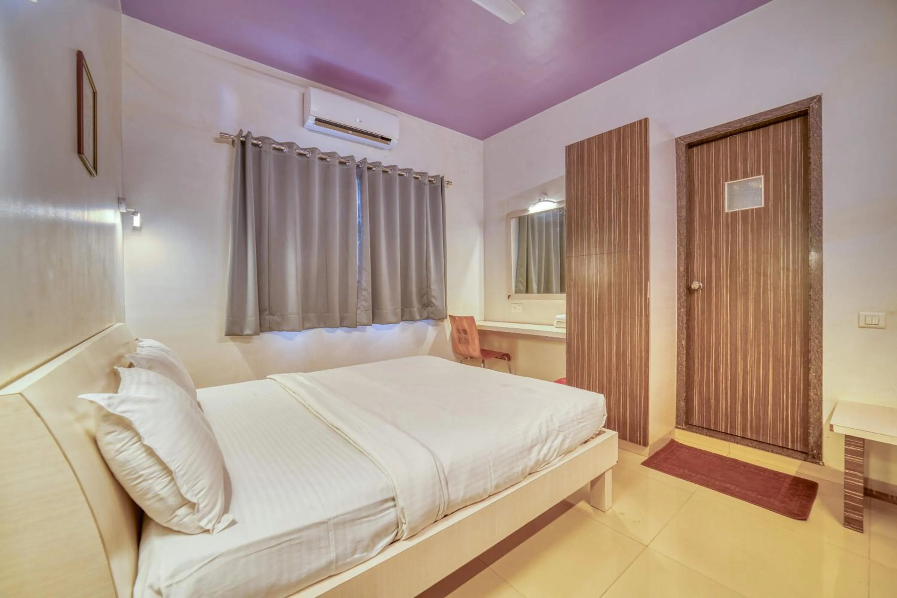 Bed in Hotel Grand Ashwin