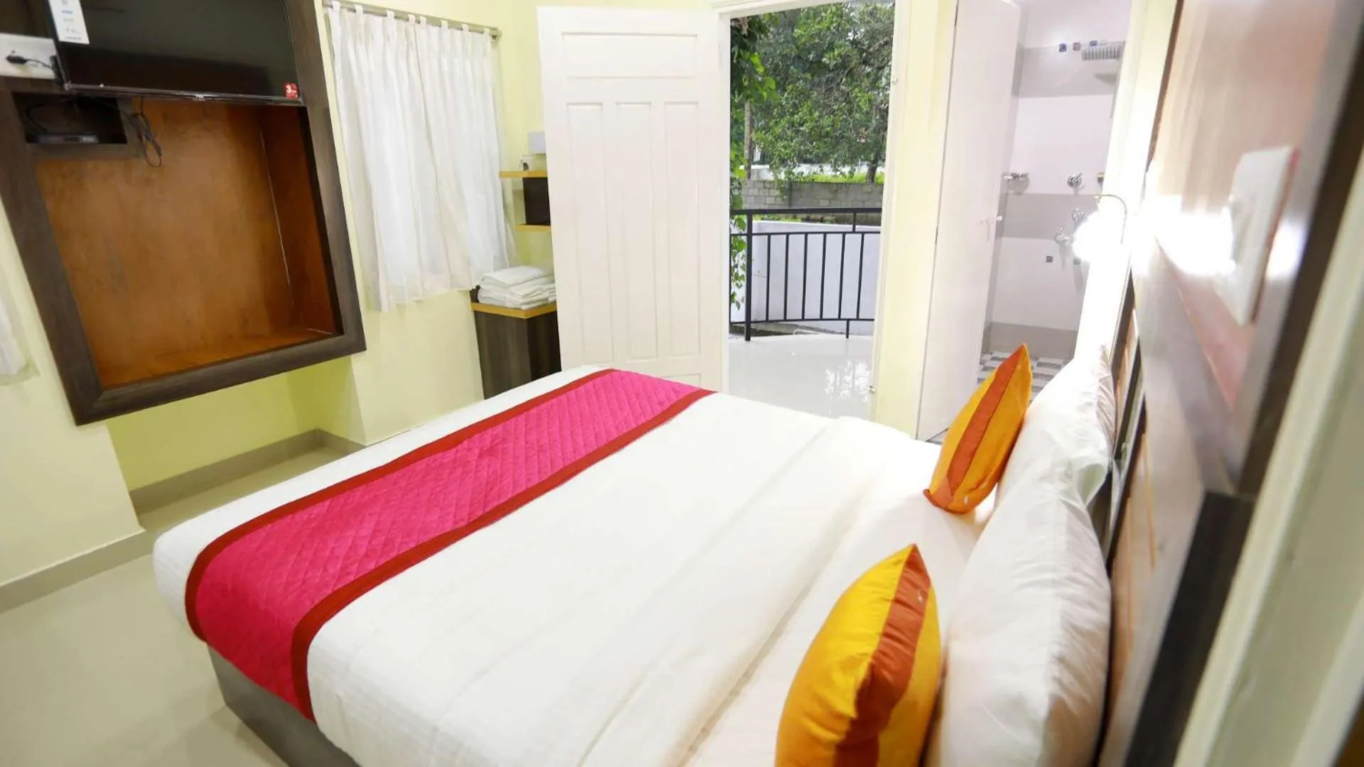 Garden view, Bed in Base9 Cochin Airport Hotel