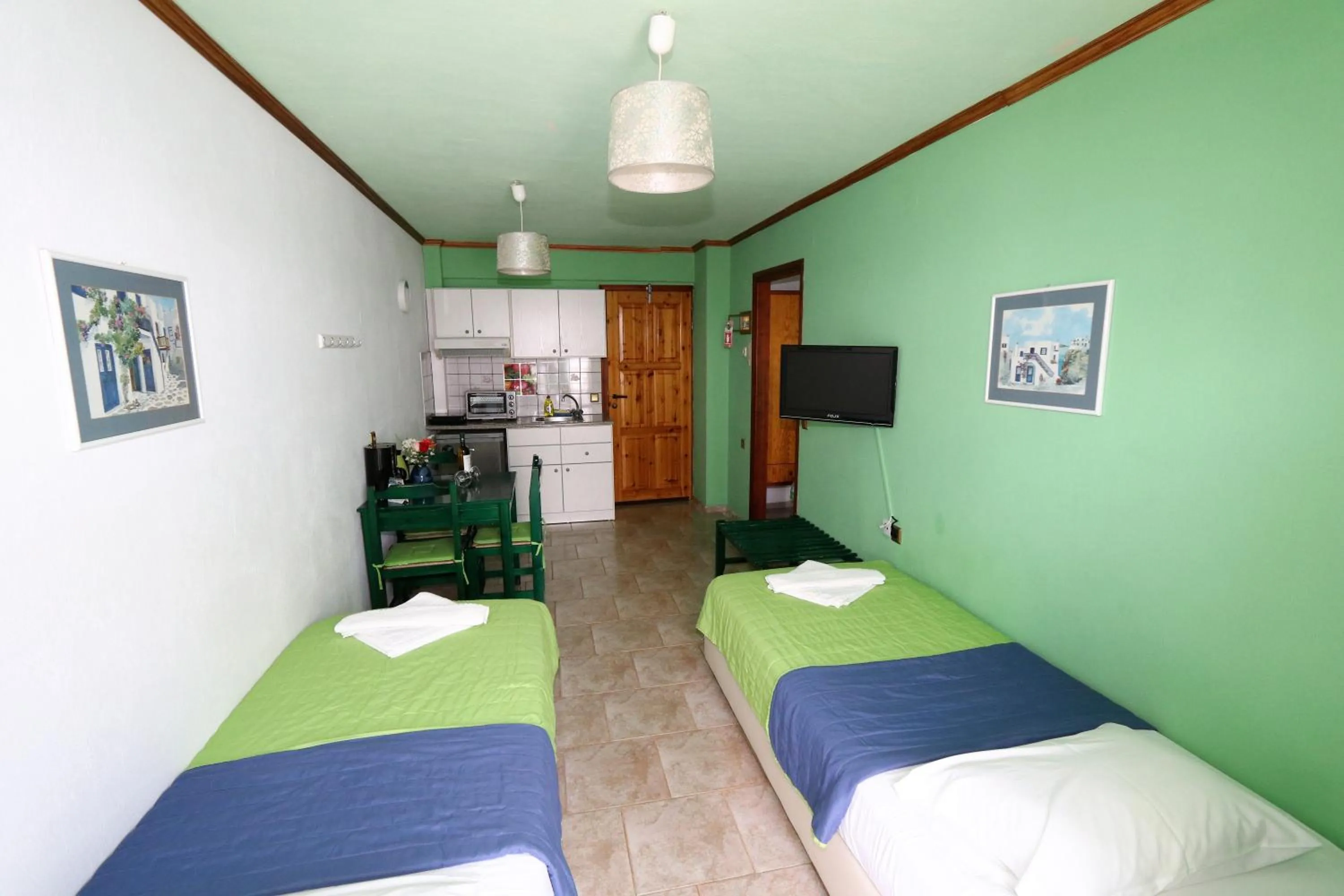 Photo of the whole room, Bed in Aris Studios