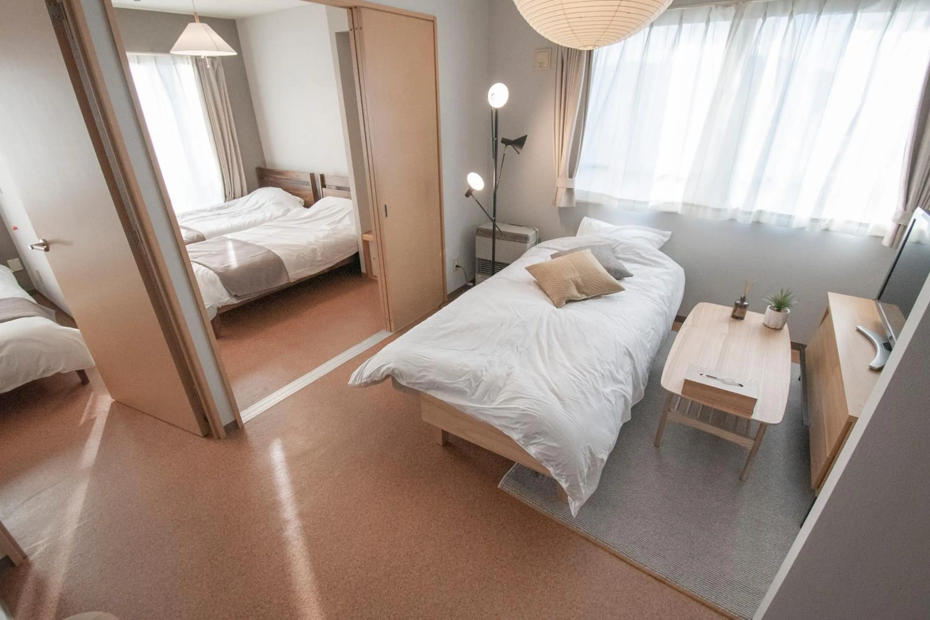 Bed in UCHI Living Stay Otaru Suitengu