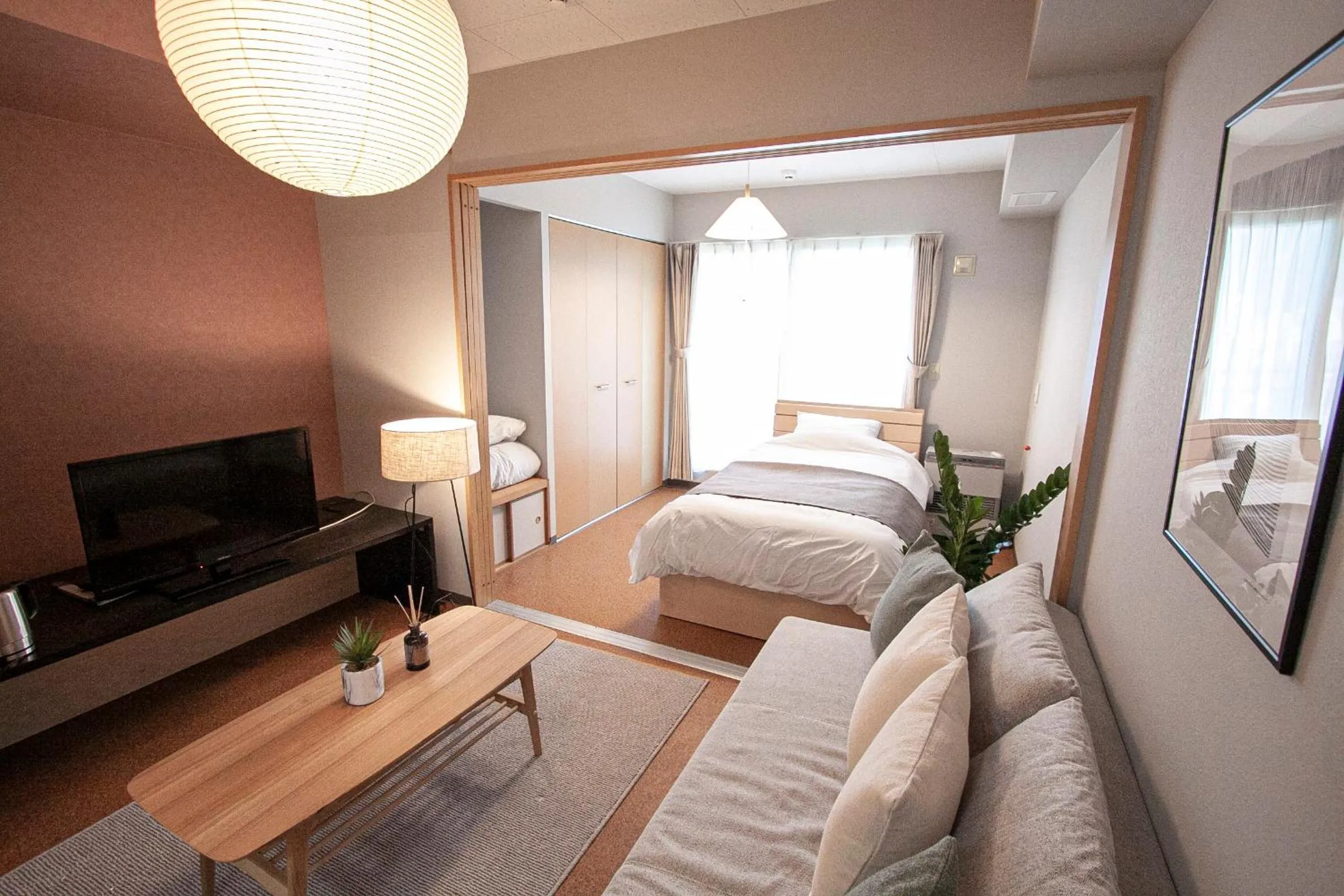 Bed in UCHI Living Stay Otaru Suitengu