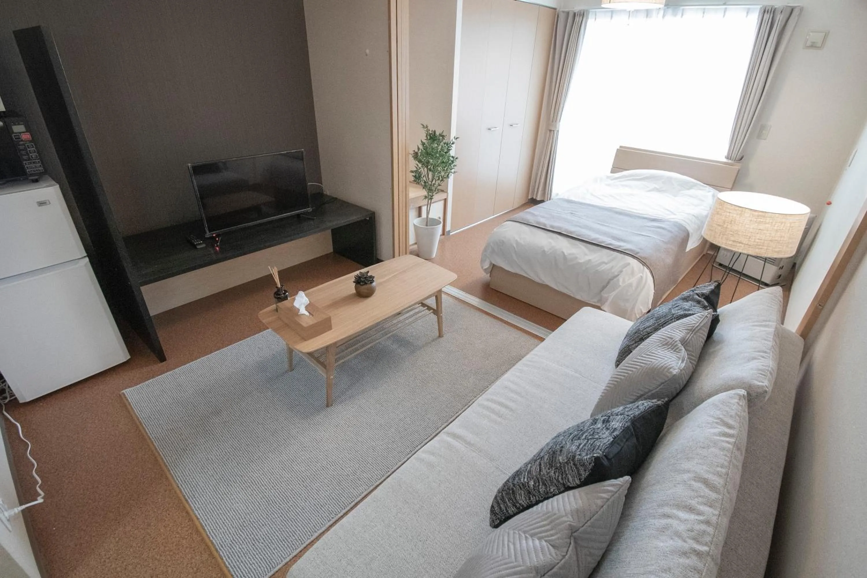 Photo of the whole room, Bed in UCHI Living Stay Otaru Suitengu