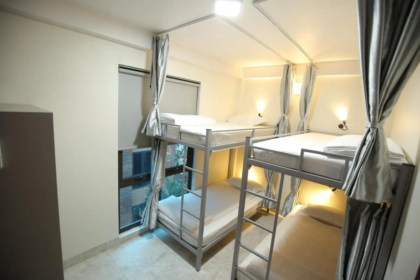 Bed in Cozynibi Hotel