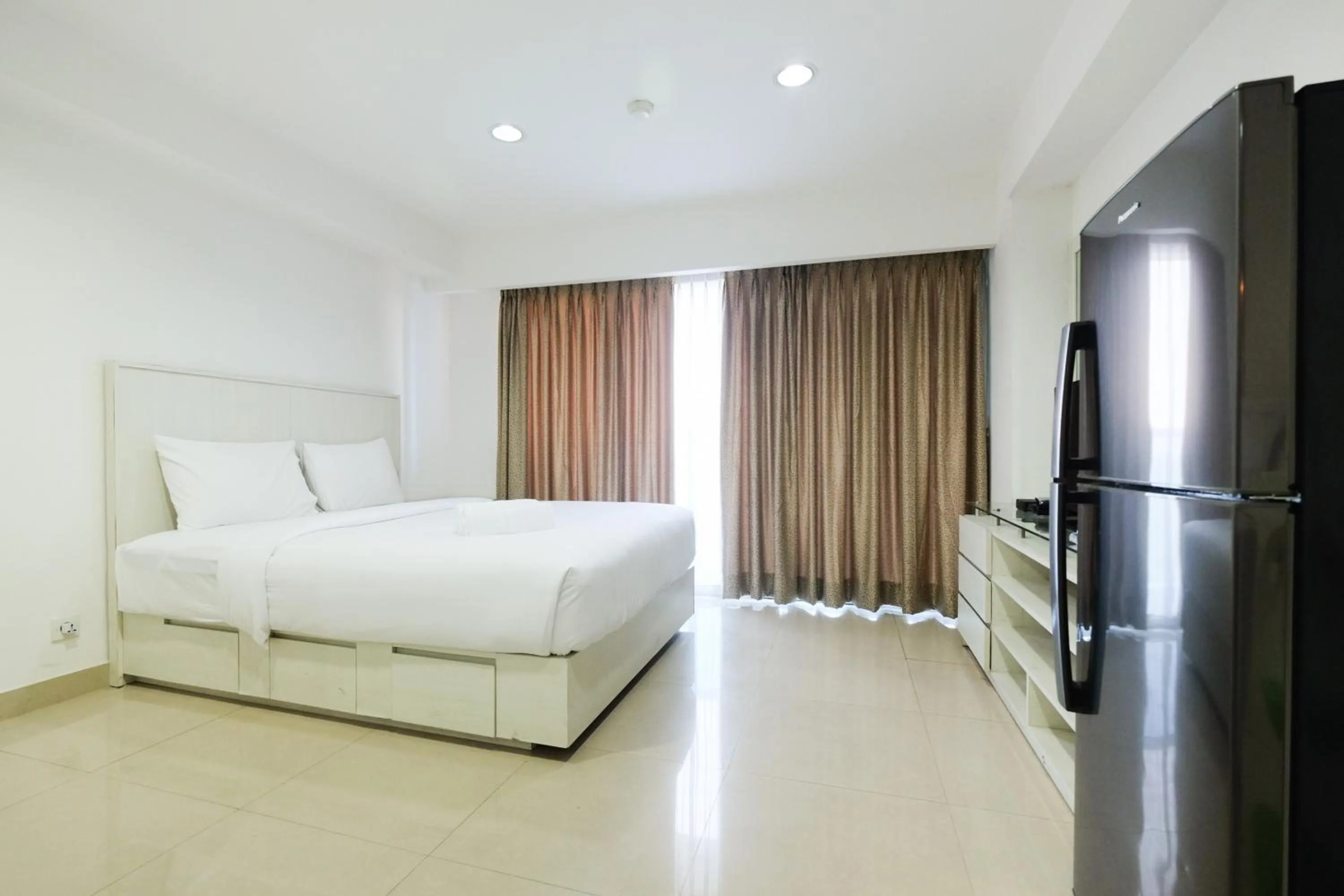 Bed in Exclusive Studio Tamansari The Hive Apartment in Strategic Location By Travelio