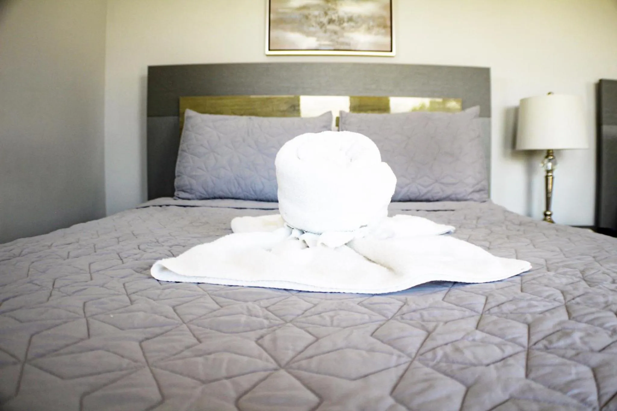 Bed in Itza-Bella Suites